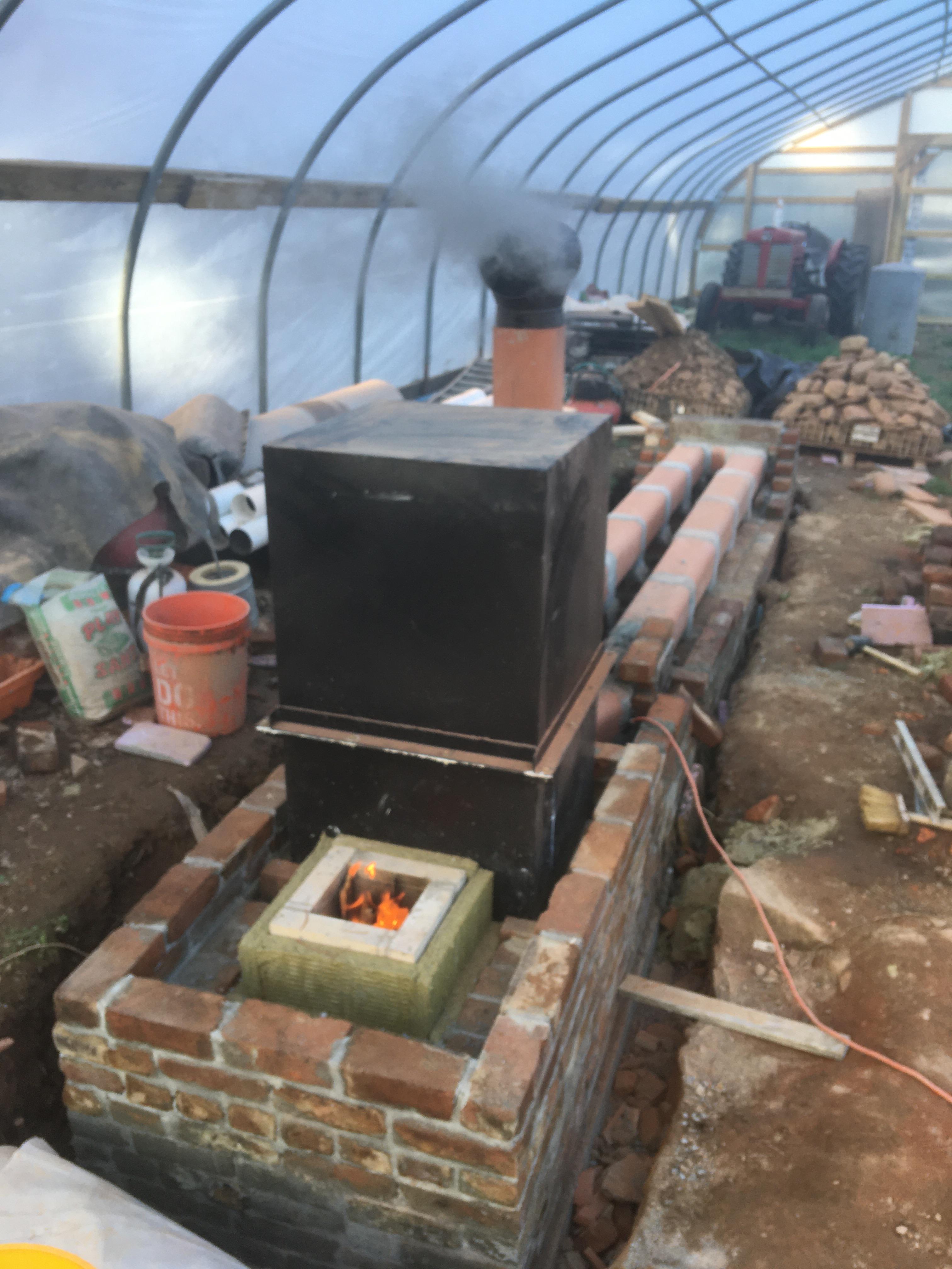 Rocket mass heater test fire. A small kindling fire proved the concept