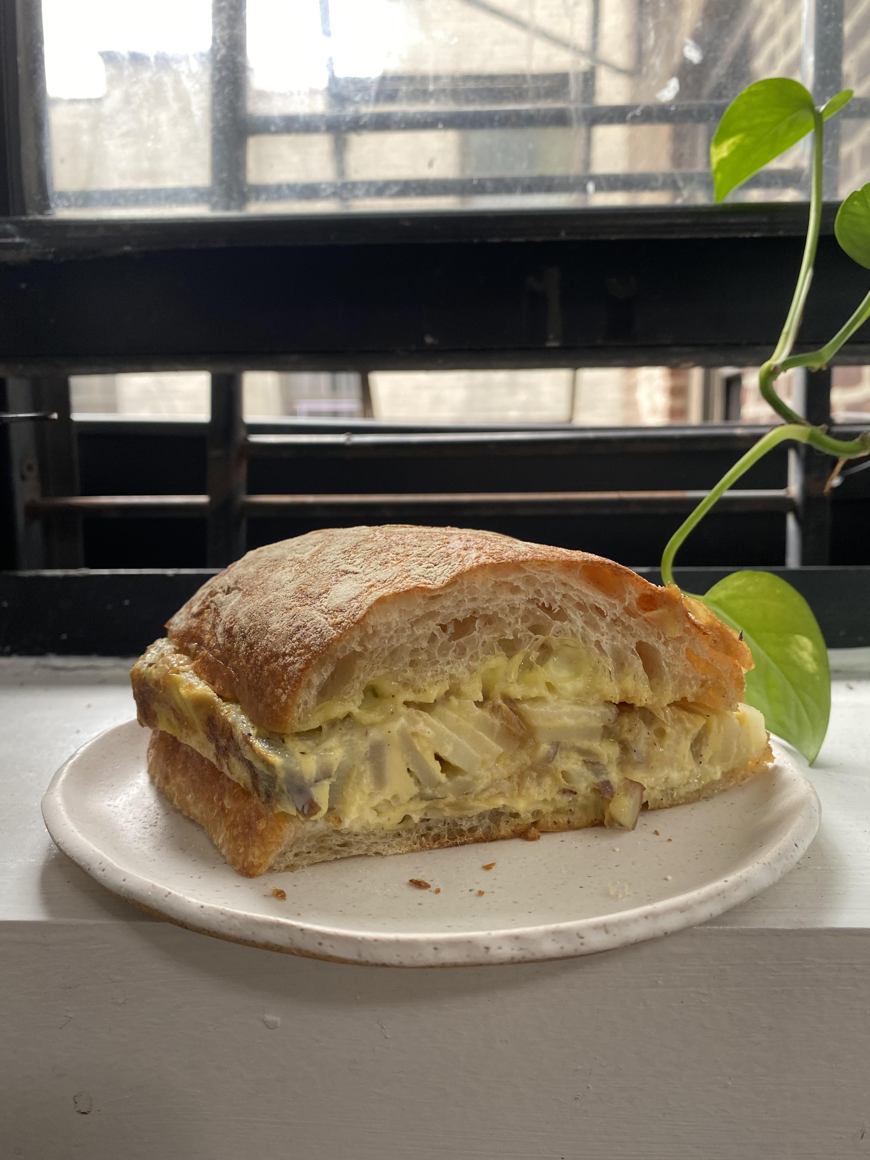 Spanish Tortilla sandwich with aioli and caramelized onions r