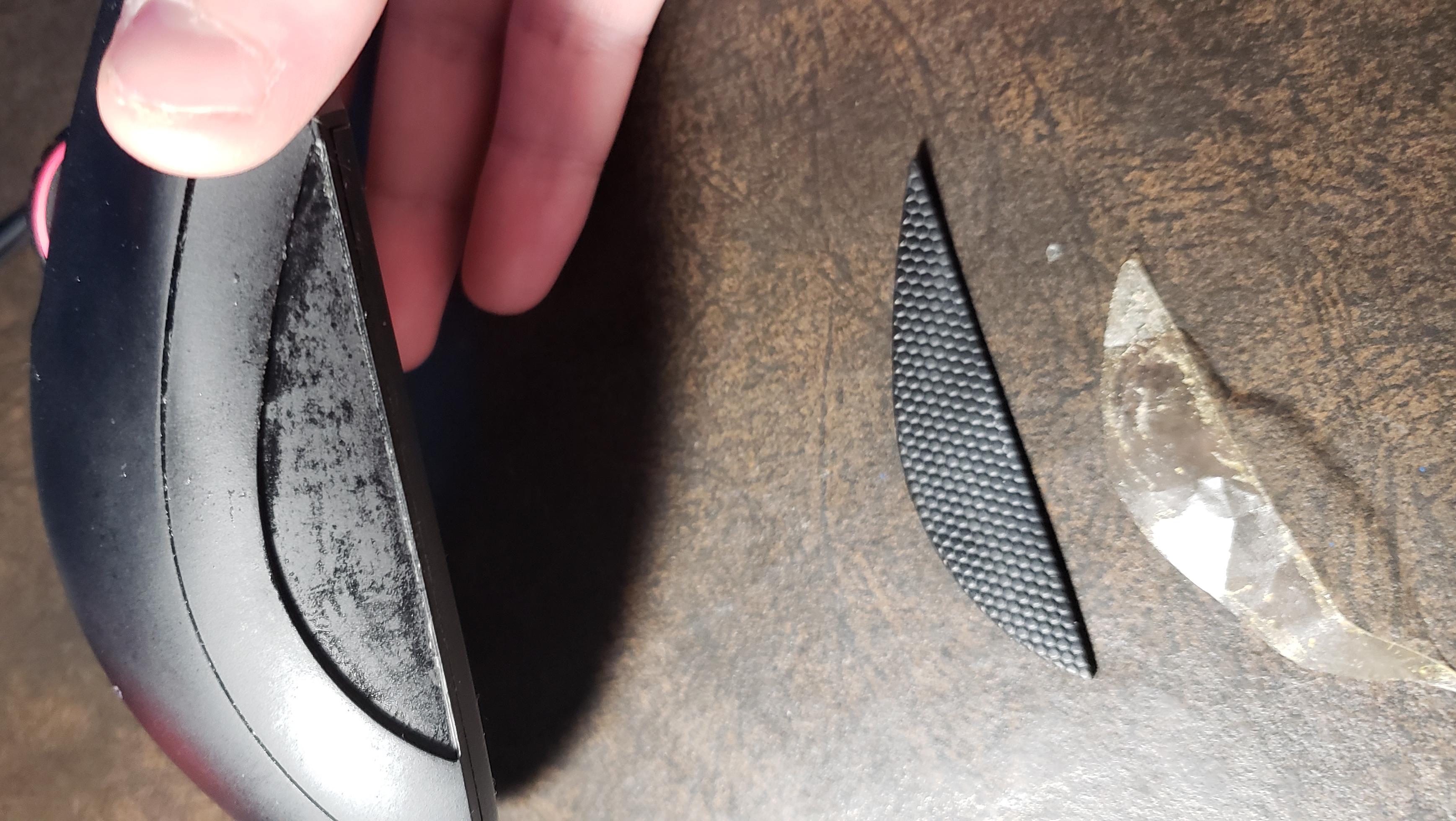 Turns out that Razer used double sided tape to attach the side grips. r/razer