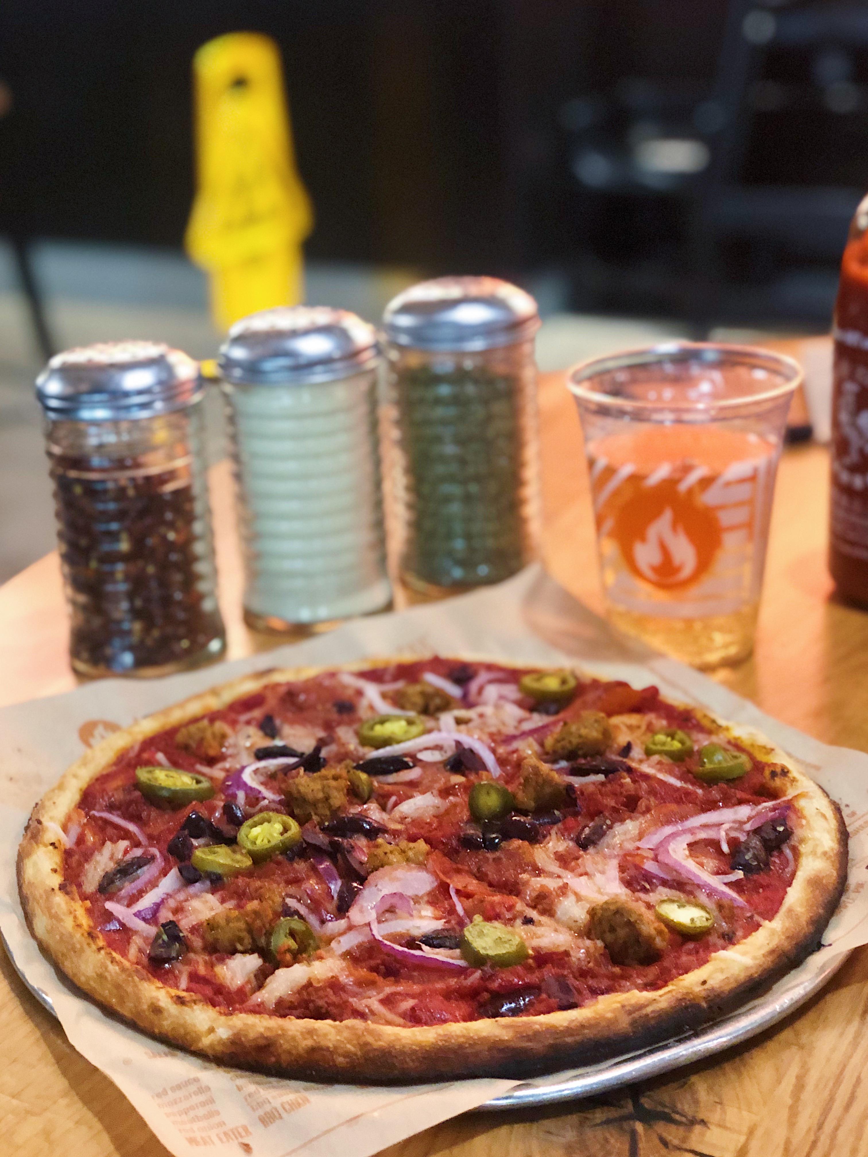 Vegan cheese pizza with pepperoni, spicy sausage and bacon at Blaze