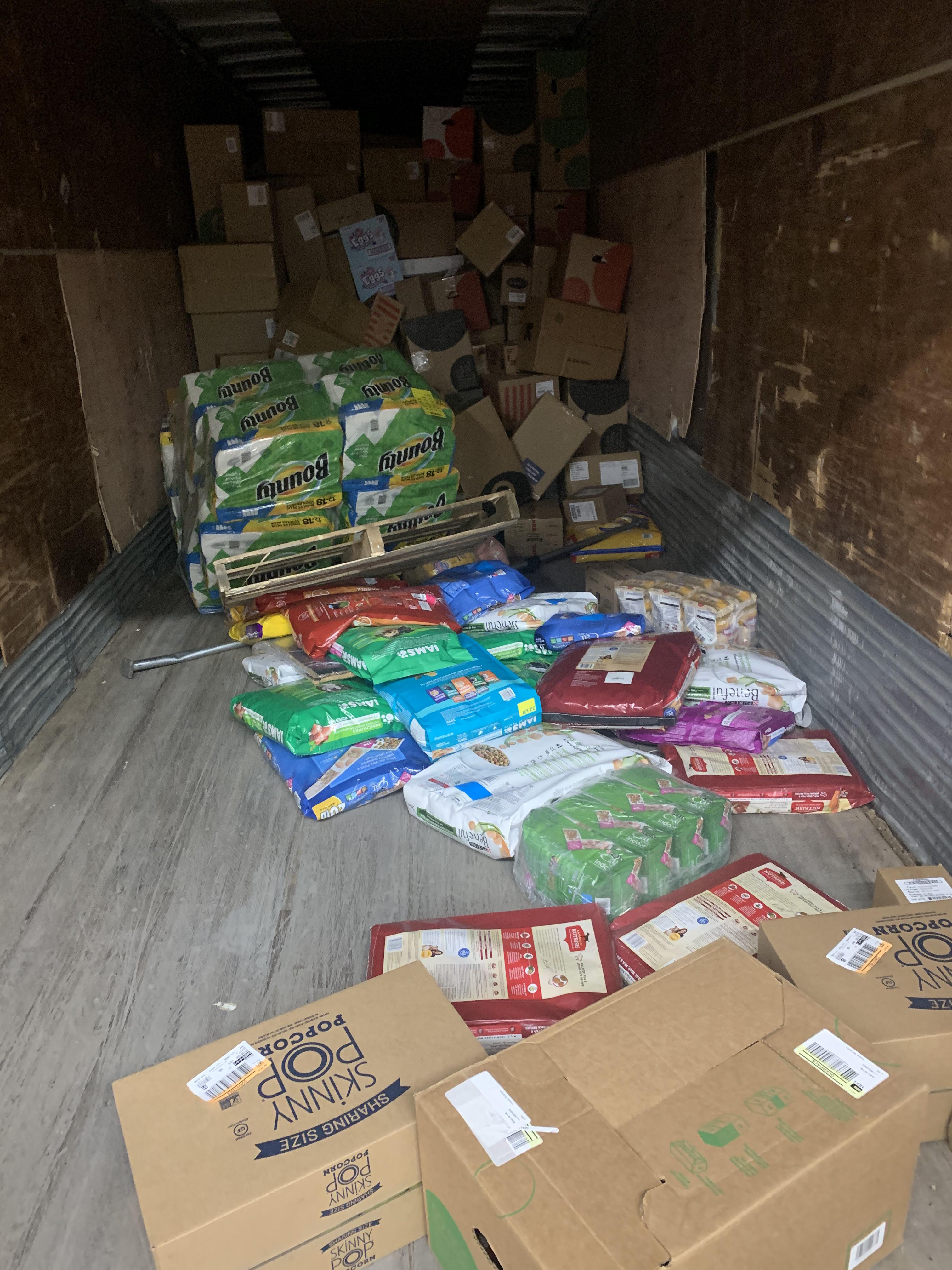 I wonder why a dog food pallet on top of a paper towel pallet at then