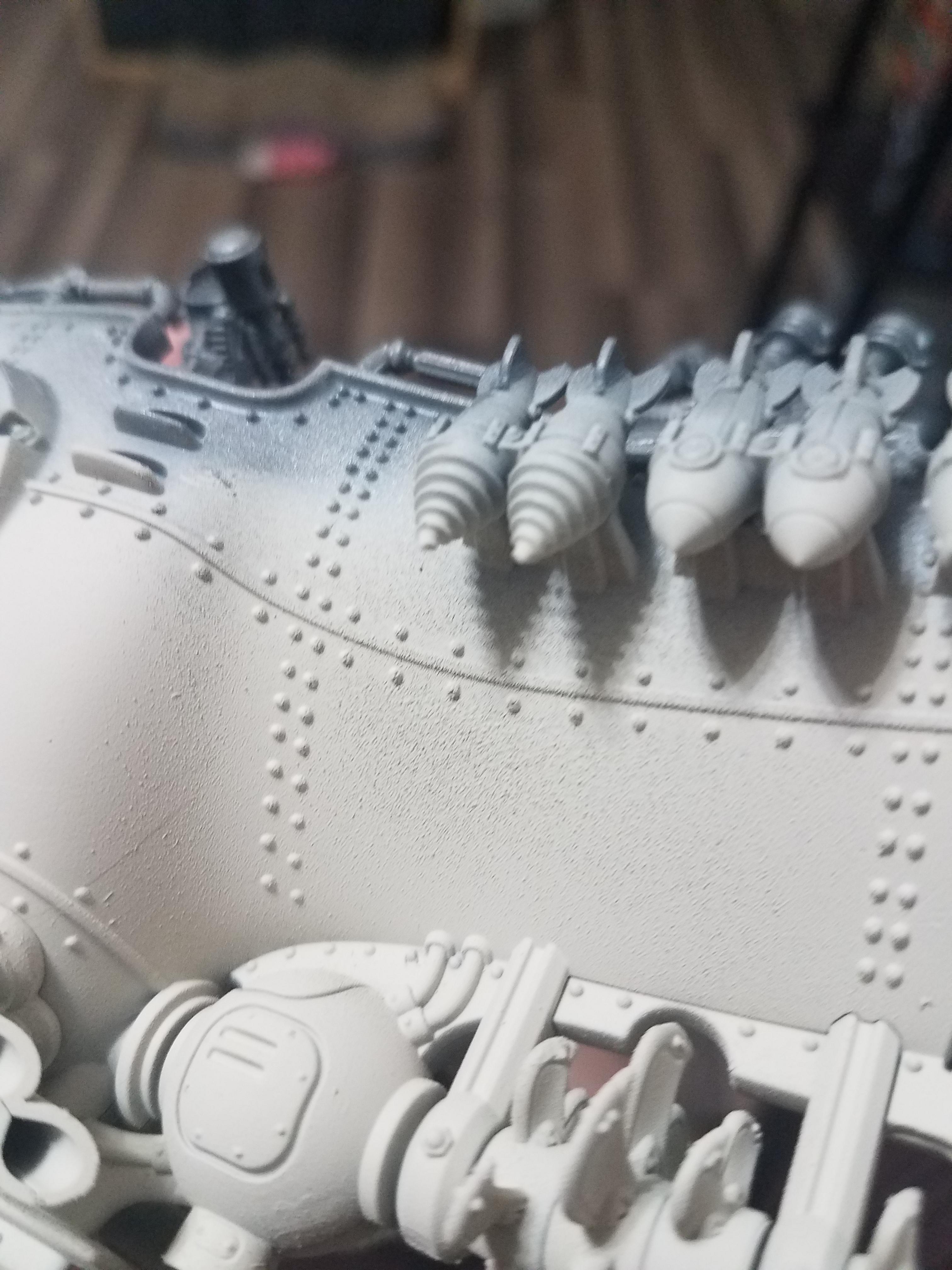 I got this grainy texture after spray priming. Any ideas how to fix it