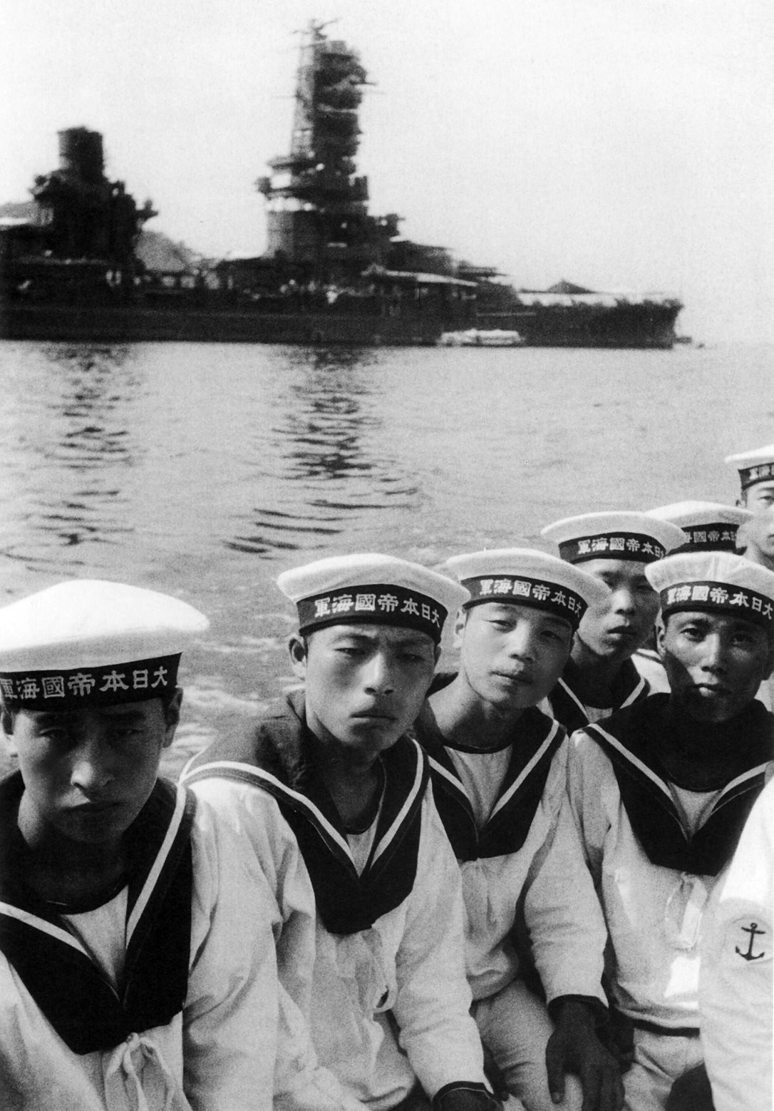 Japanese sailors in dress uniform with the battleship Ise in the background, 1943 r/WorldWar2