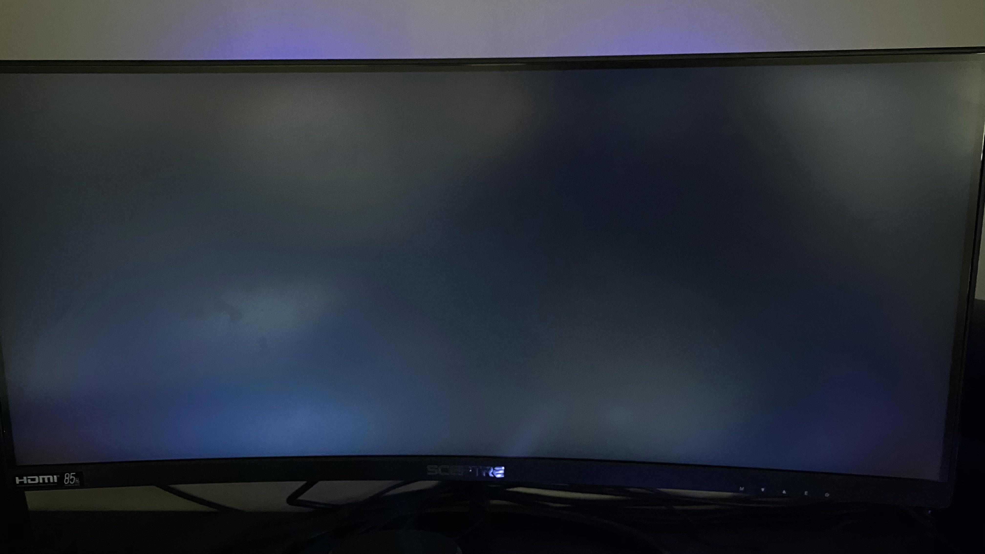 My monitor is stuck on this glowing black screen like if it’s on but