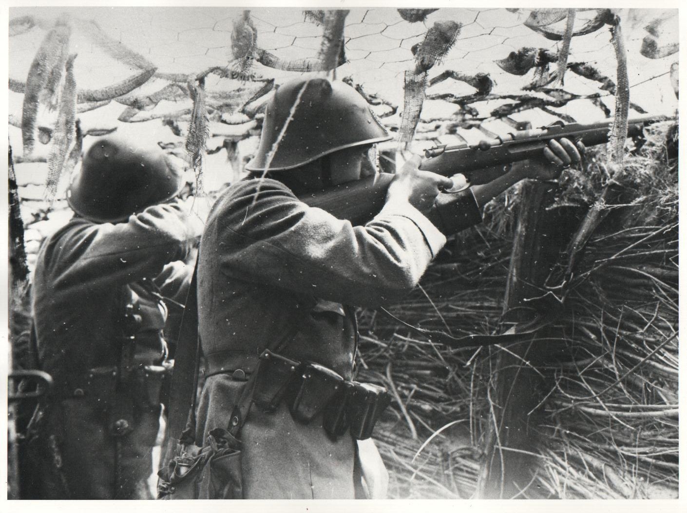 Two Dutch soldiers man defensive positions near Rhenen during the