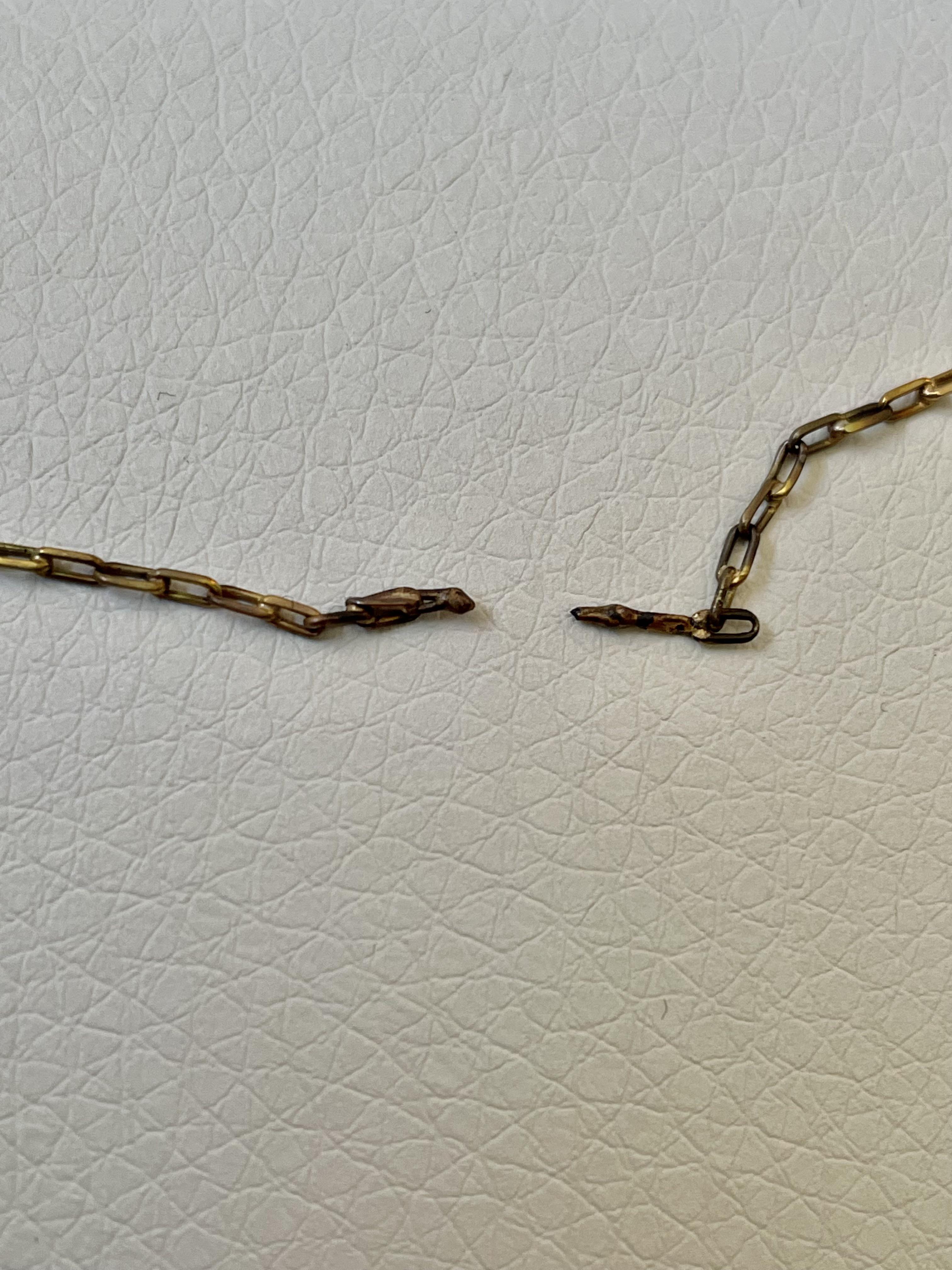 Is it possible to melt 18k gold with a match? The chain in the picture