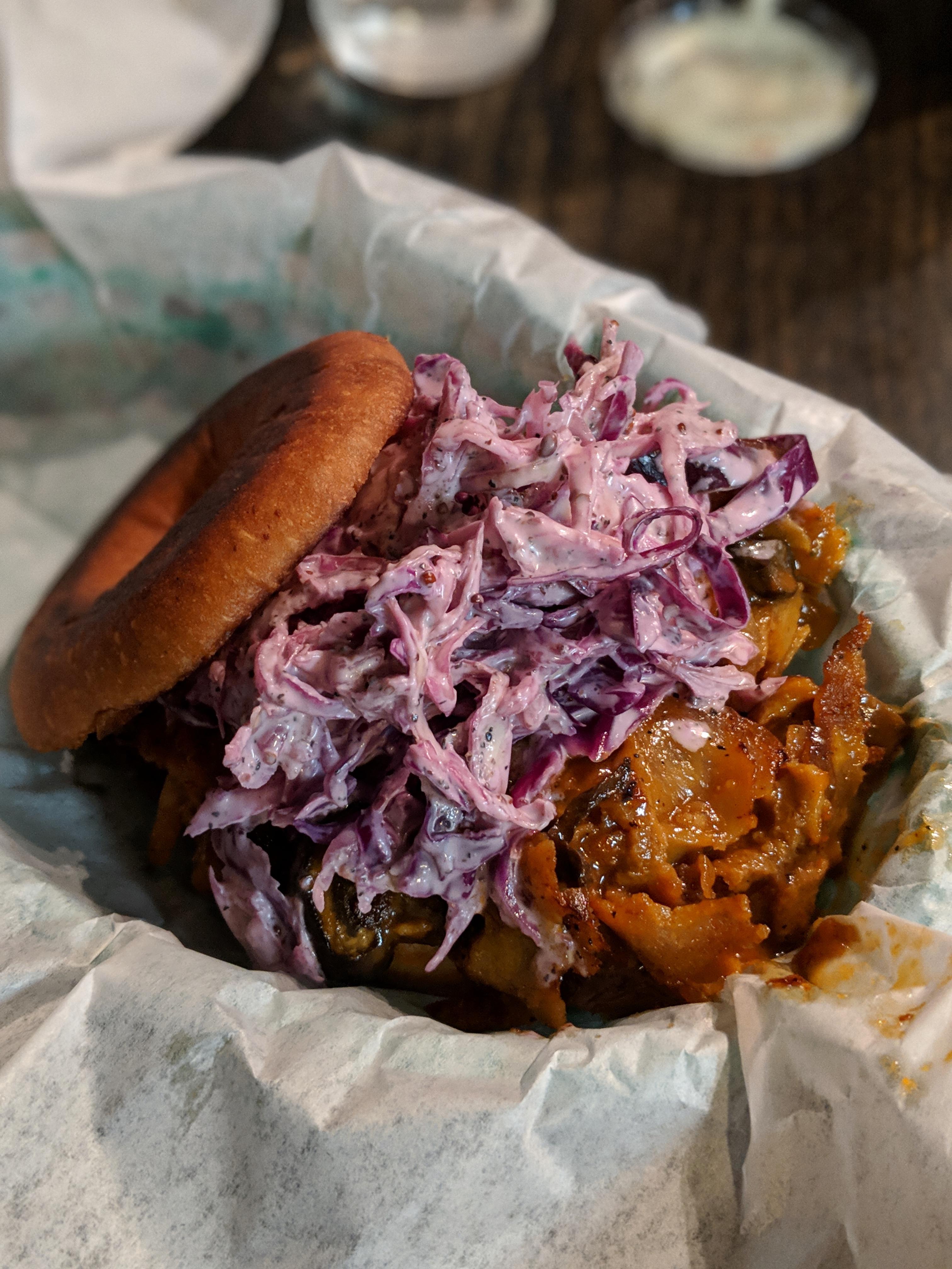 BBQ seitan, mushrooms, onions, black pepper cole slaw served on a donut