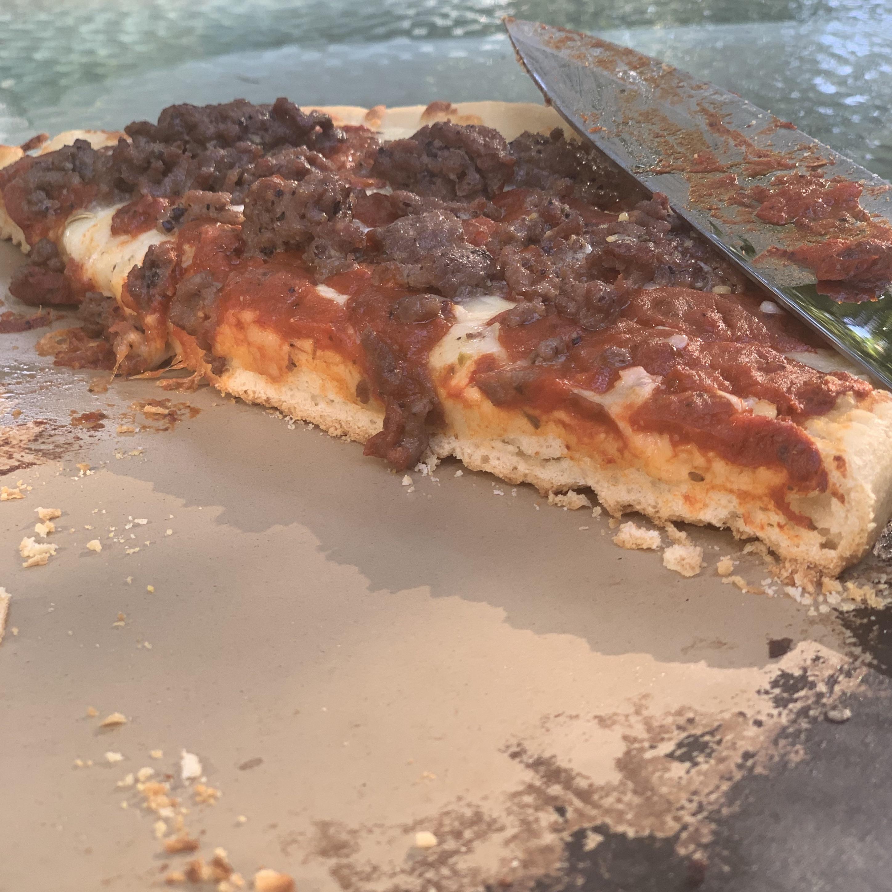 I’ve discovered that baking a storebought frozen pizza in my Camp Chef
