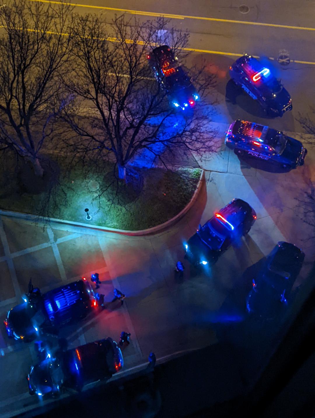 12 police cars pulled over a white suburban in front of the Courtyard