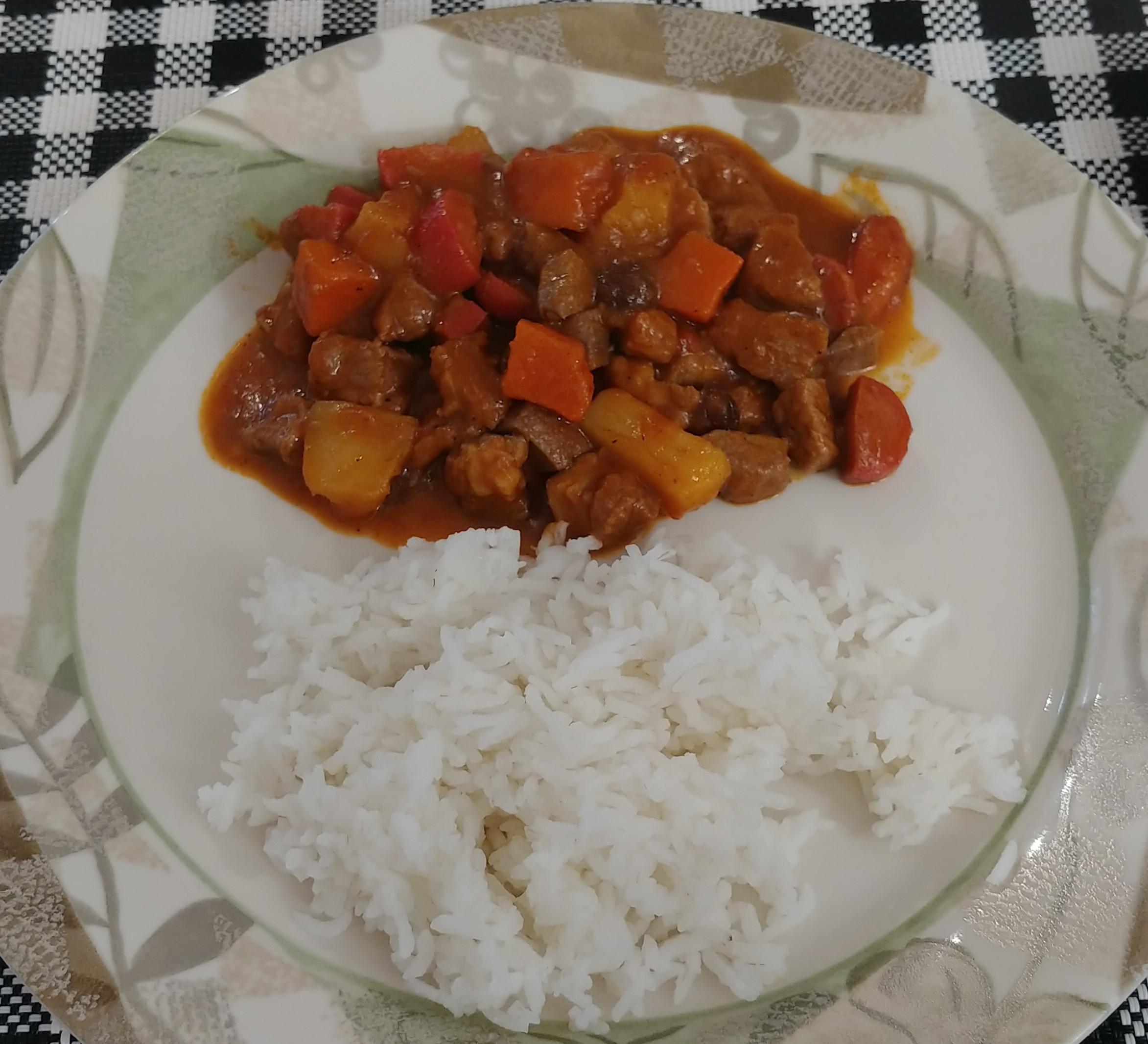 A typical filipino homemade meal. Filipino menudo paired with steamed