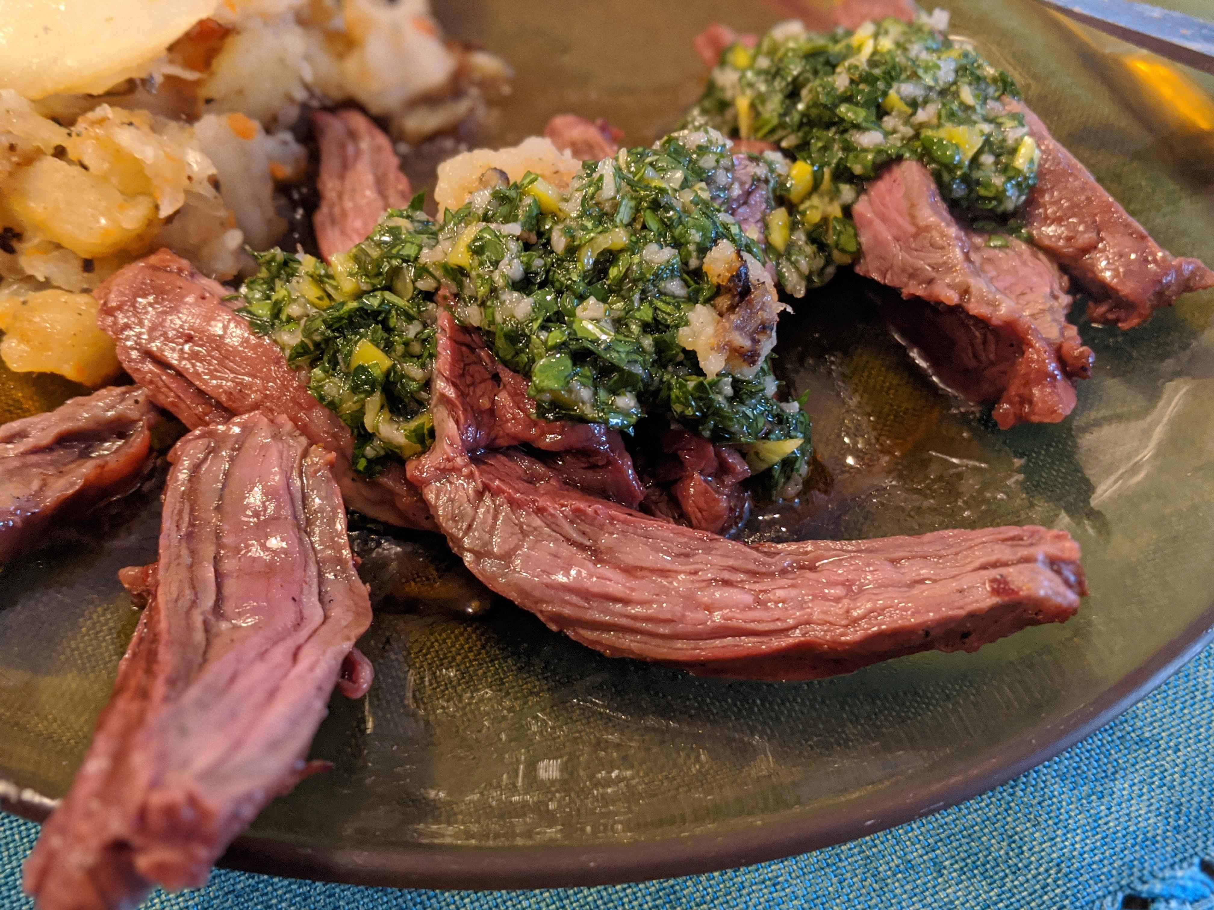 Skirt Steak cooked at high temp over cherry wood. Chimichurri rough