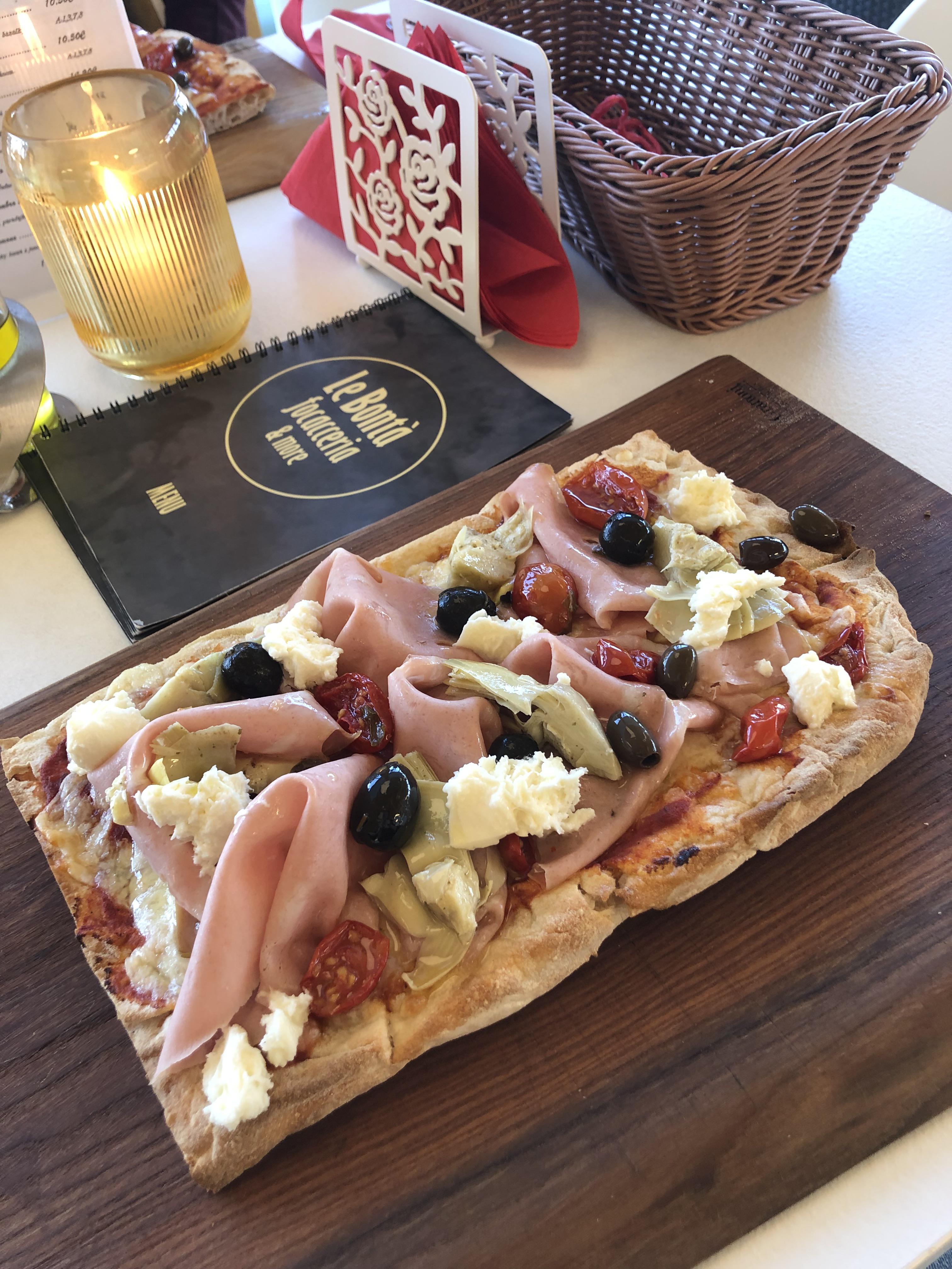 Focaccia with mortadella con pistacchio, mozarella, cherry tomatoes
