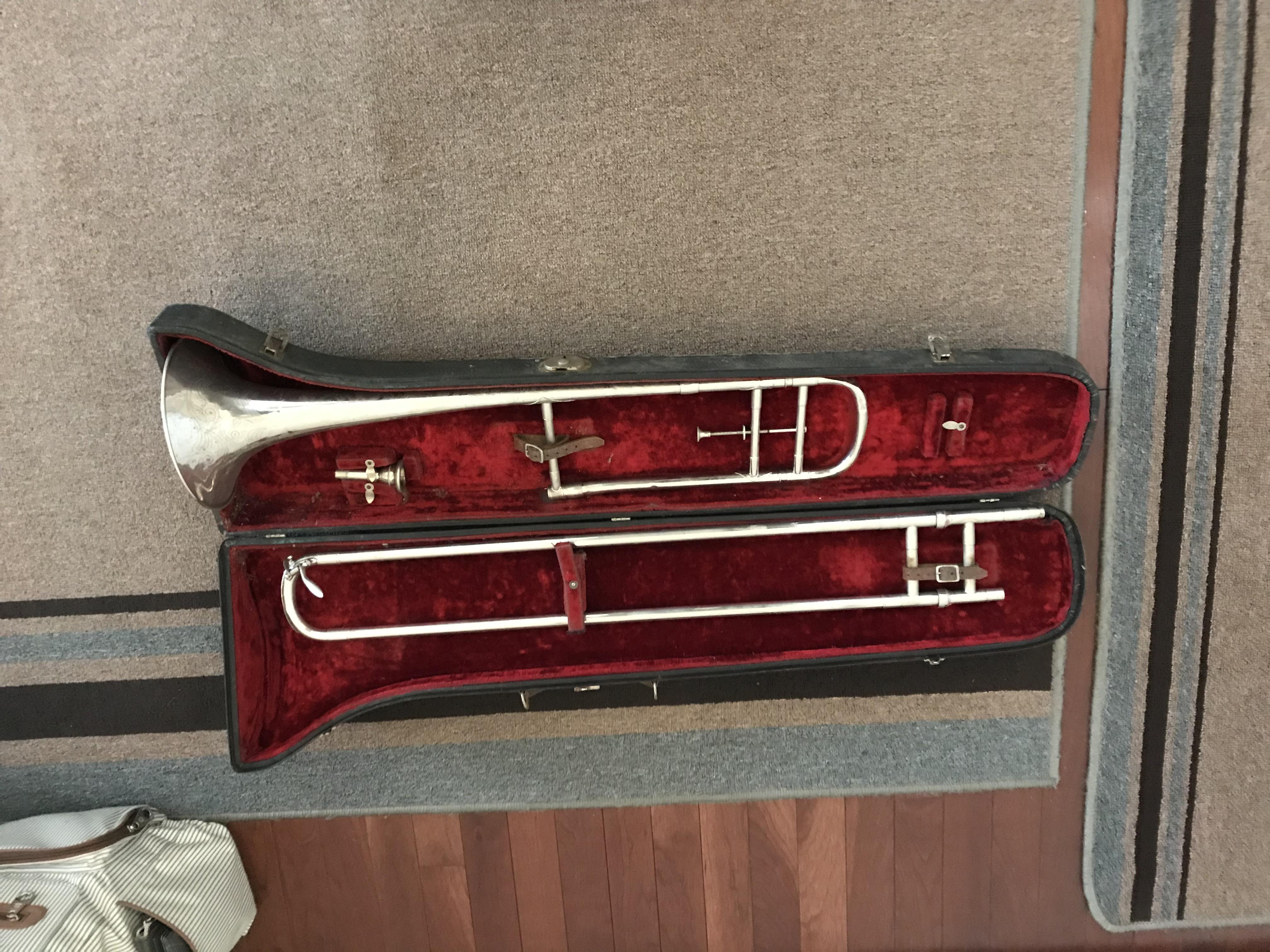 Found this beautiful old trombone in my grandparents from house. Says