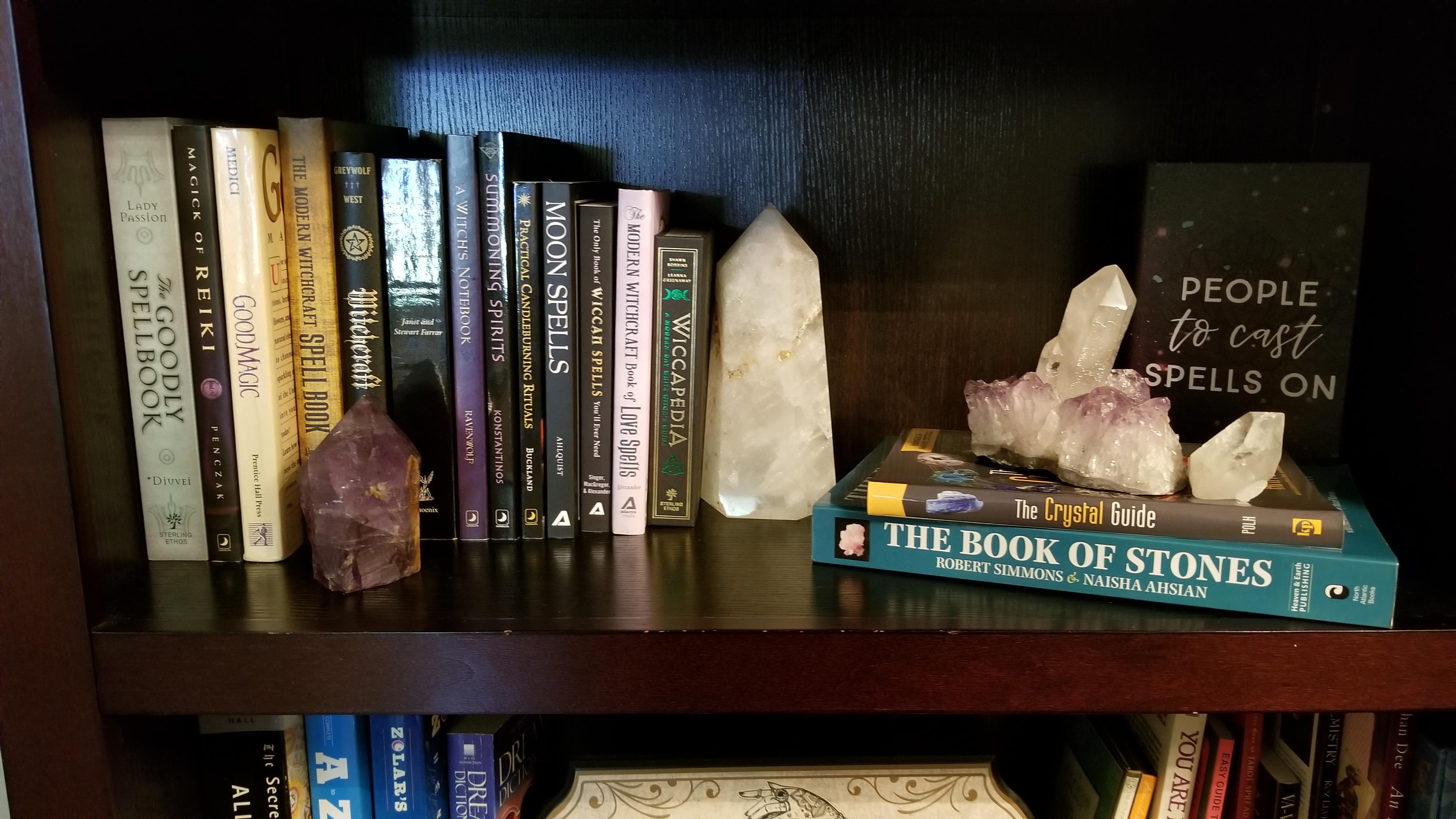 Our favorite shelf of books and some of our crystals. r/Crystals