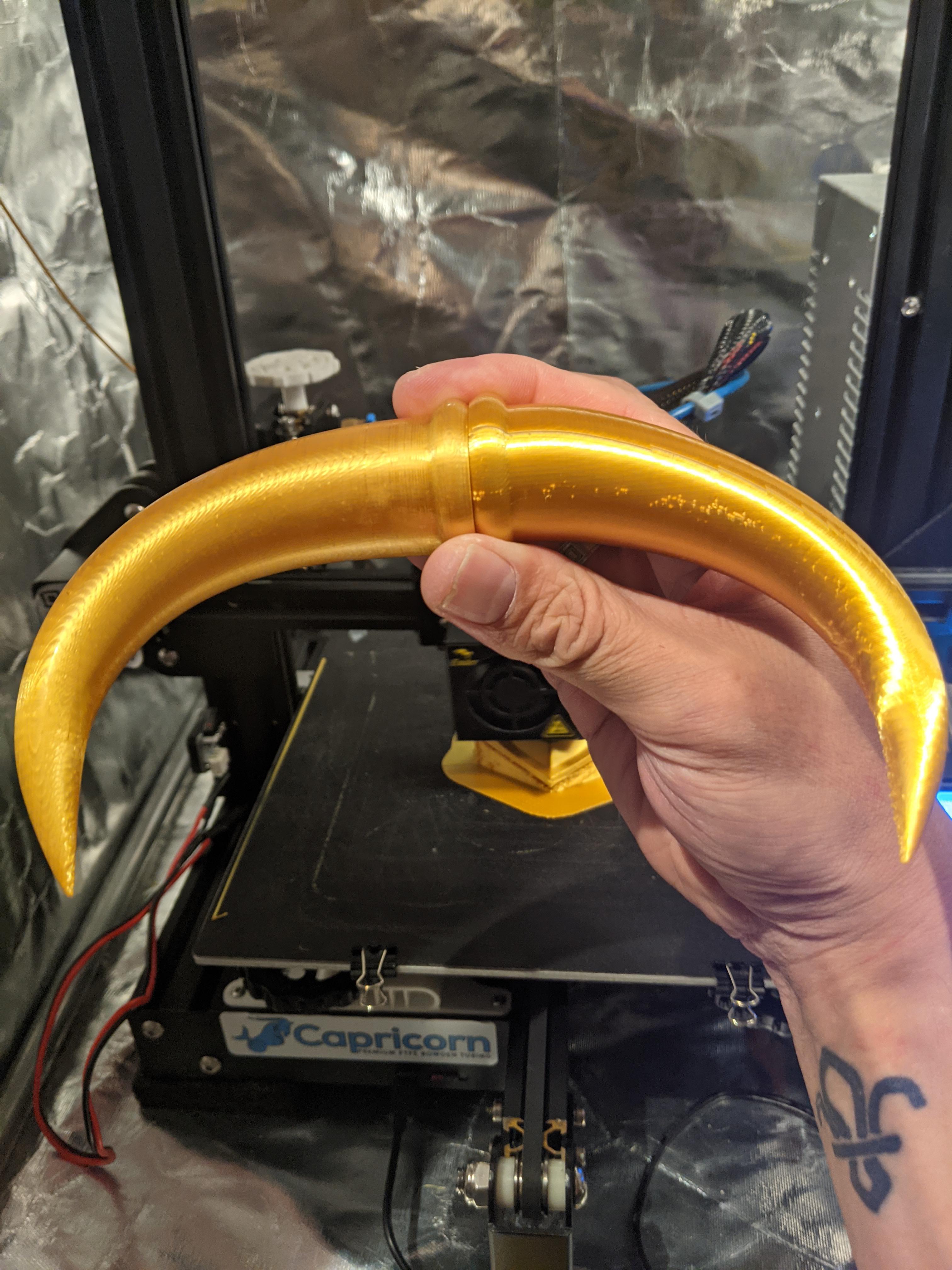 Experimenting with sanding silk PLA. Progressively sanded the left hand