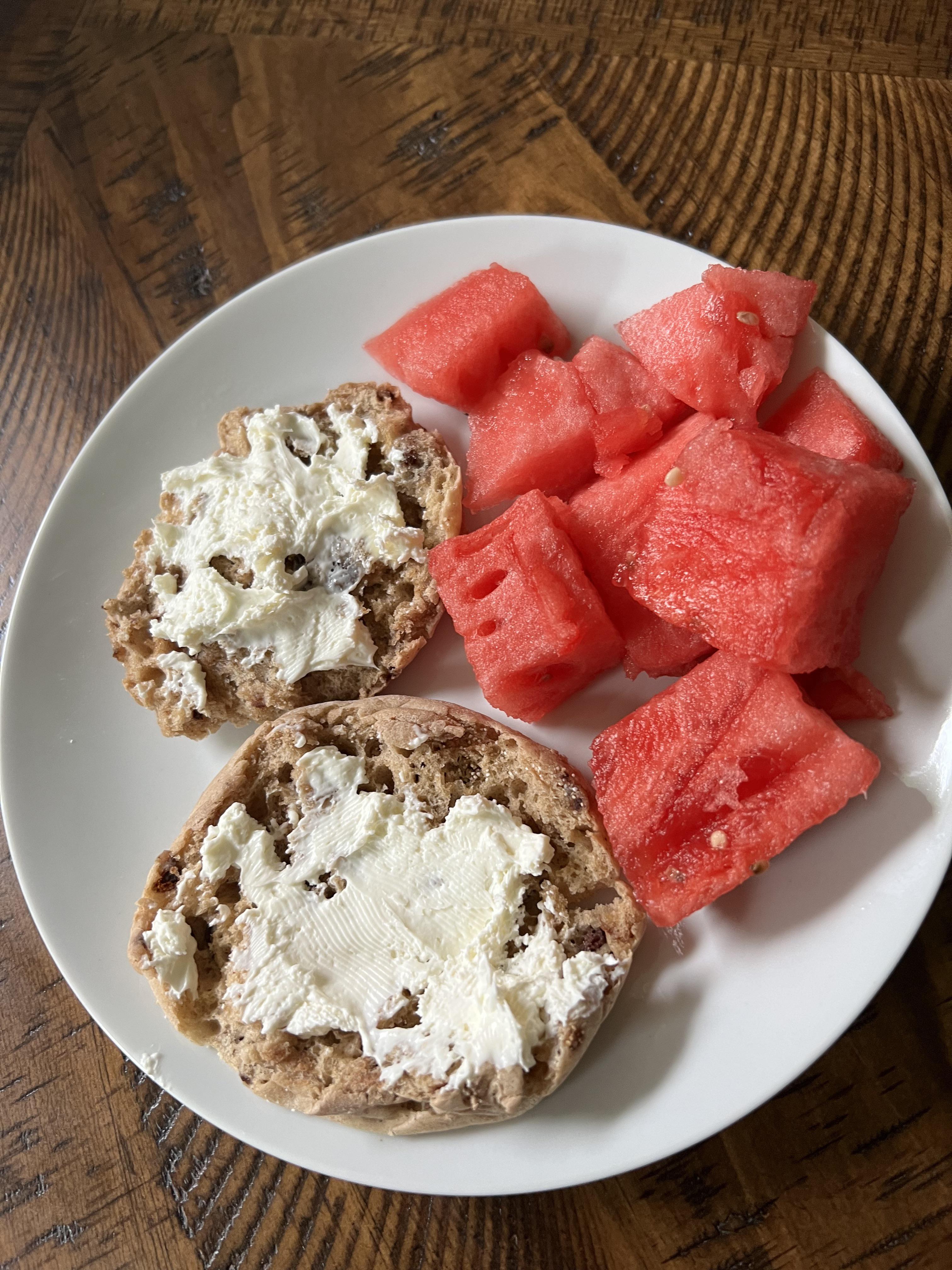 Cinnamon raisin English muffin with whipped cream cheese and watermelon