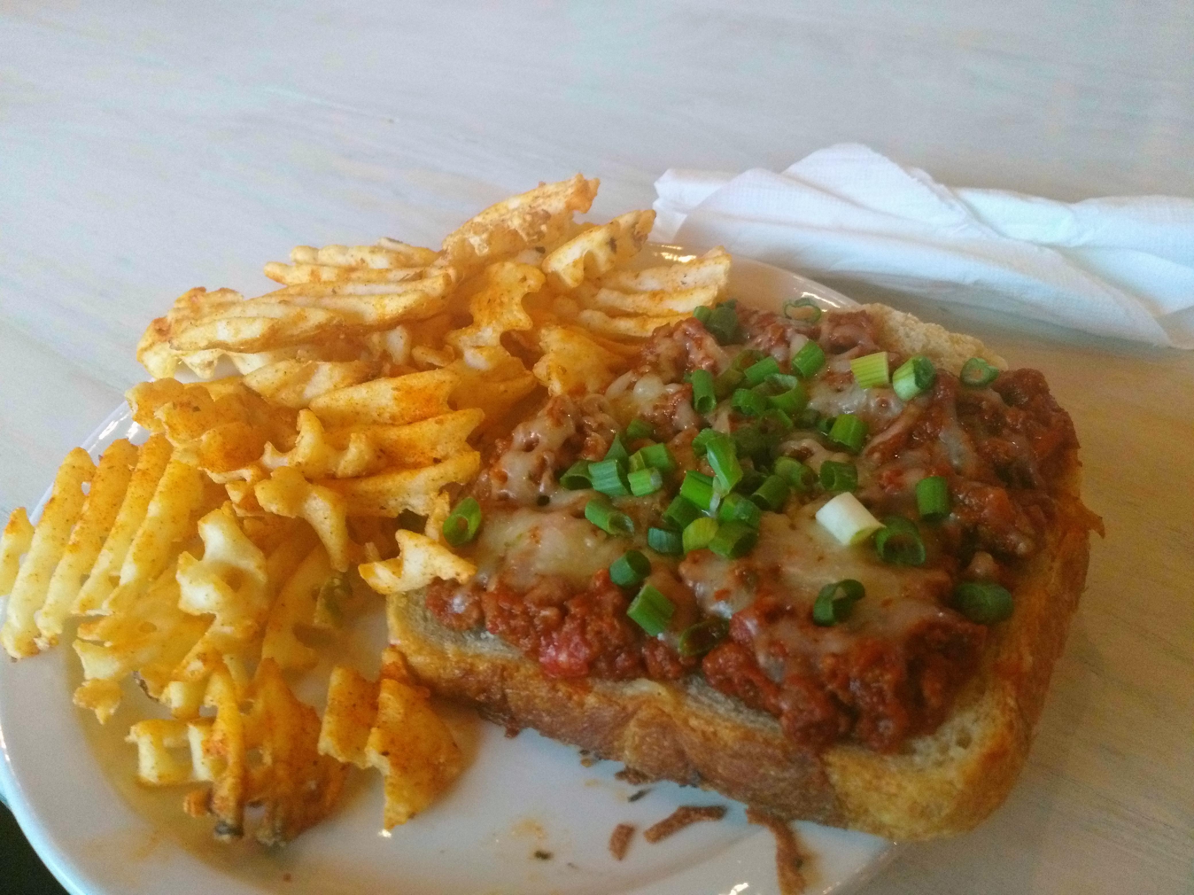 Openface sloppy joe with pepper jack, green onions, and a side of