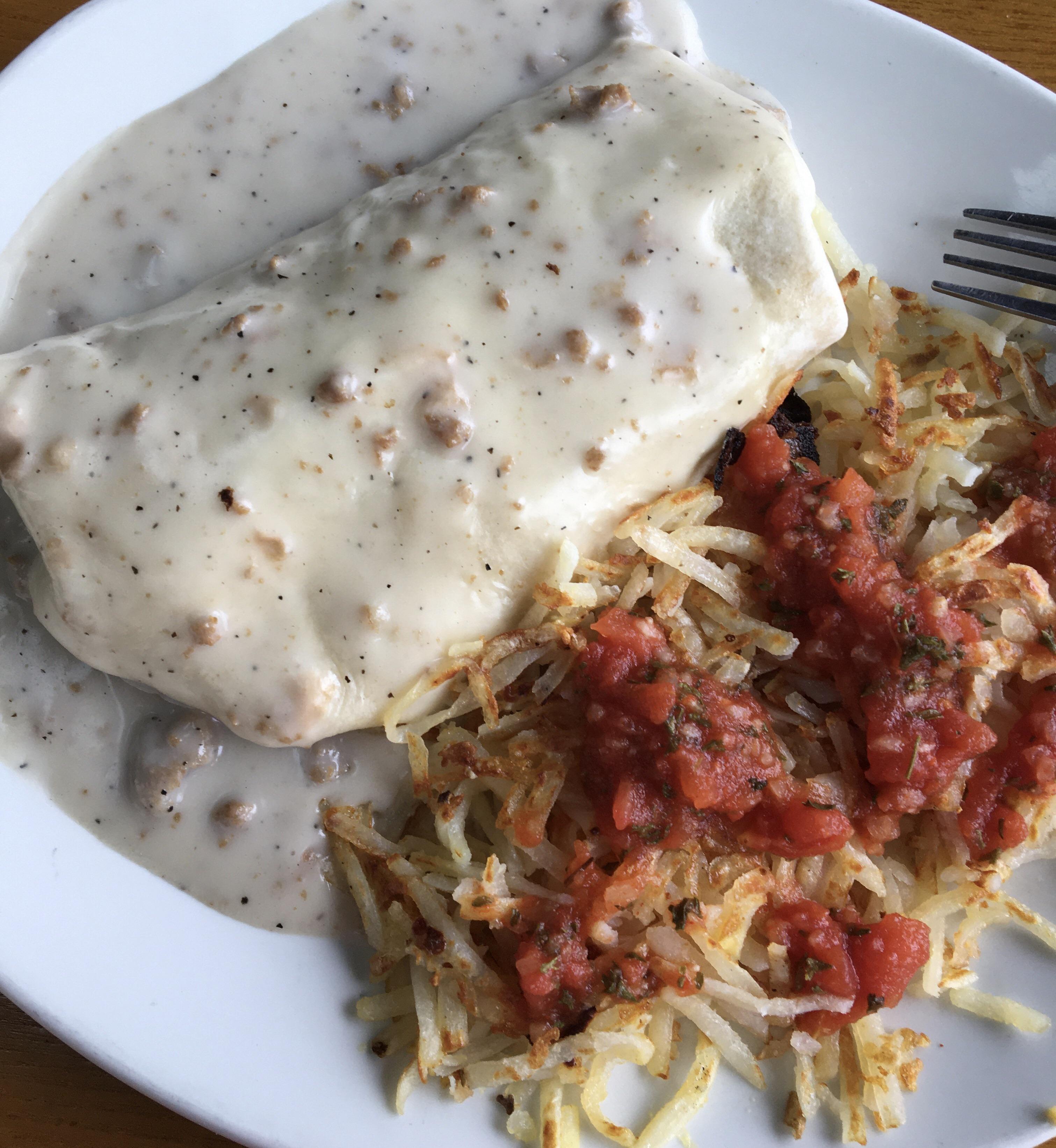 Shitty but delicious! Breakfast burrito smothered in country sausage gravy. r/shittyfoodporn