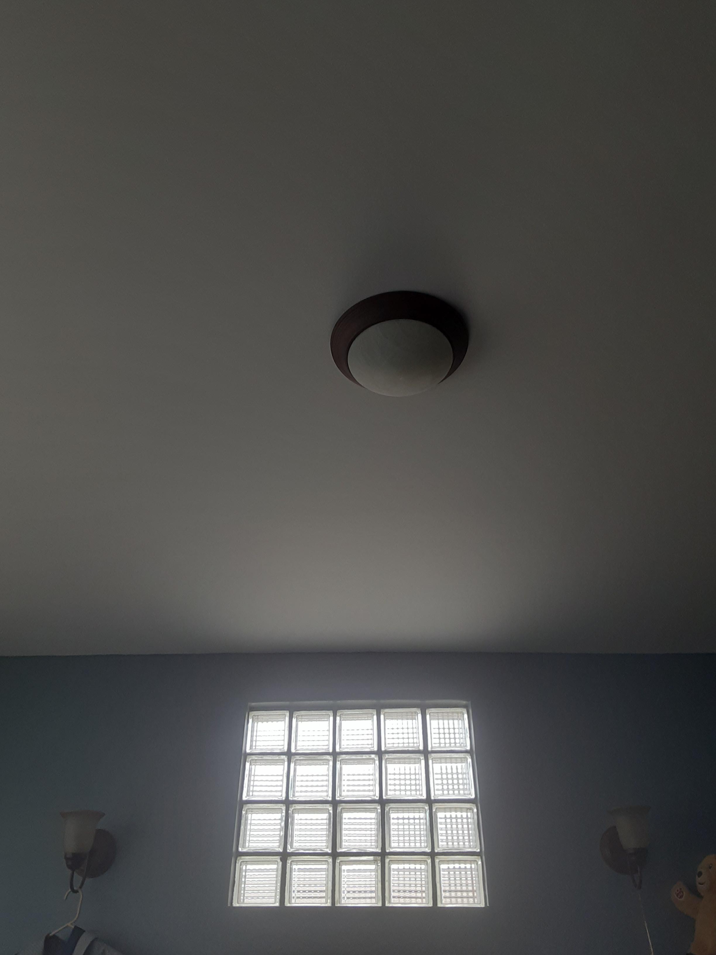 My rooms light not centered with window and window shines in my face in