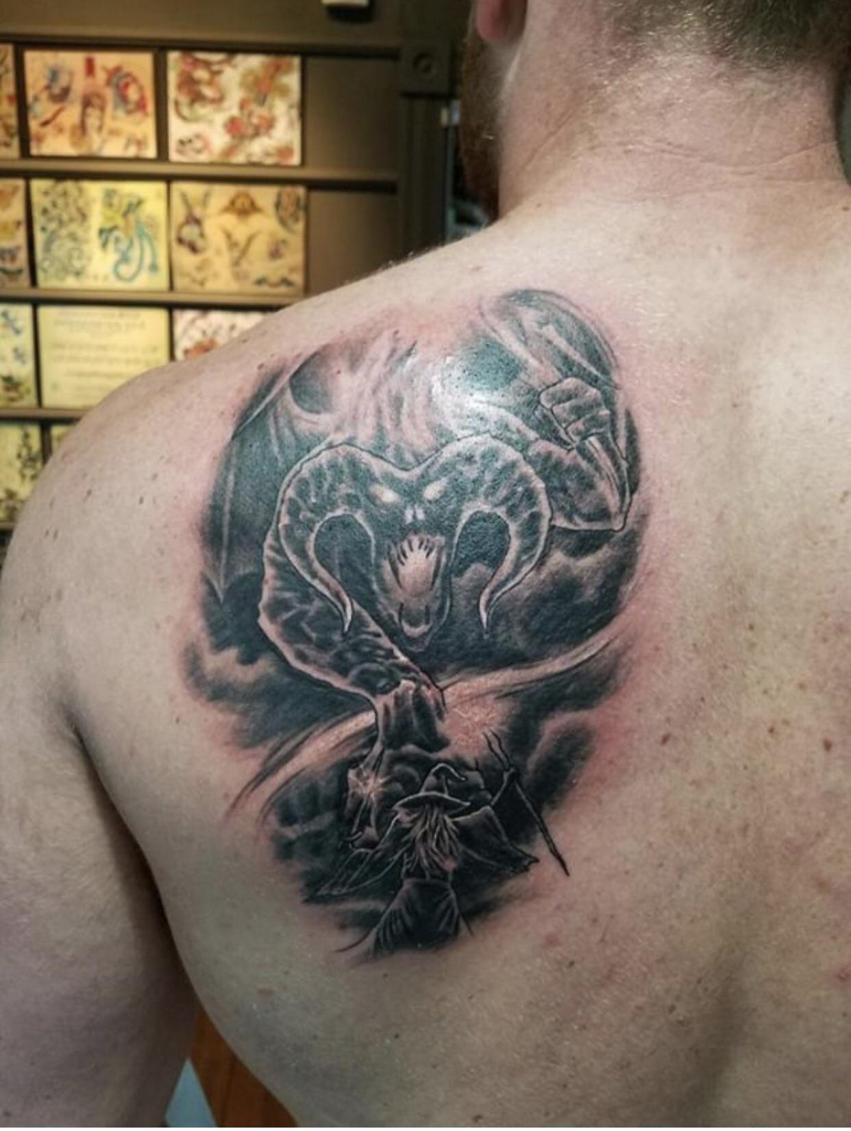 Gandolf facing the Balrog by Jesse at Tattoo Salvation in Louisville KY