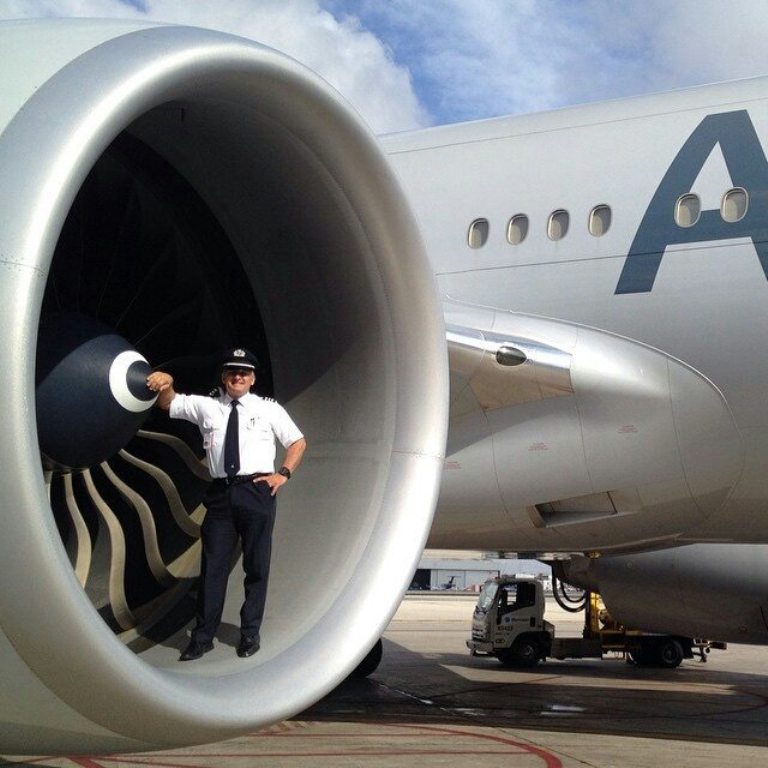 Pilot in the intake of a Rolls-Royce Trent 800 engine on a Boeing 777