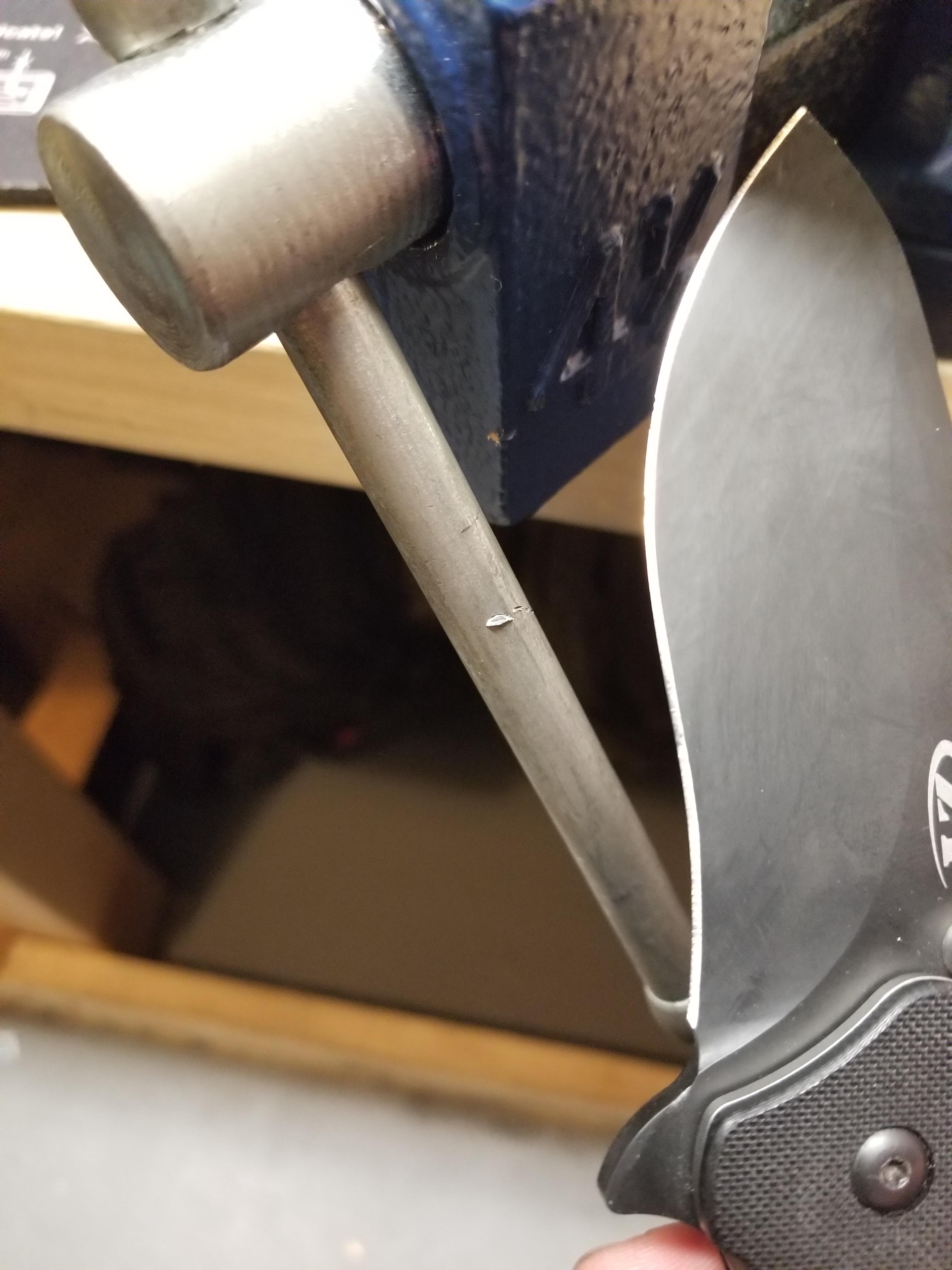 Knife slipped and hit my bench vice...did more damage to the vice than the blade. Good job ZT