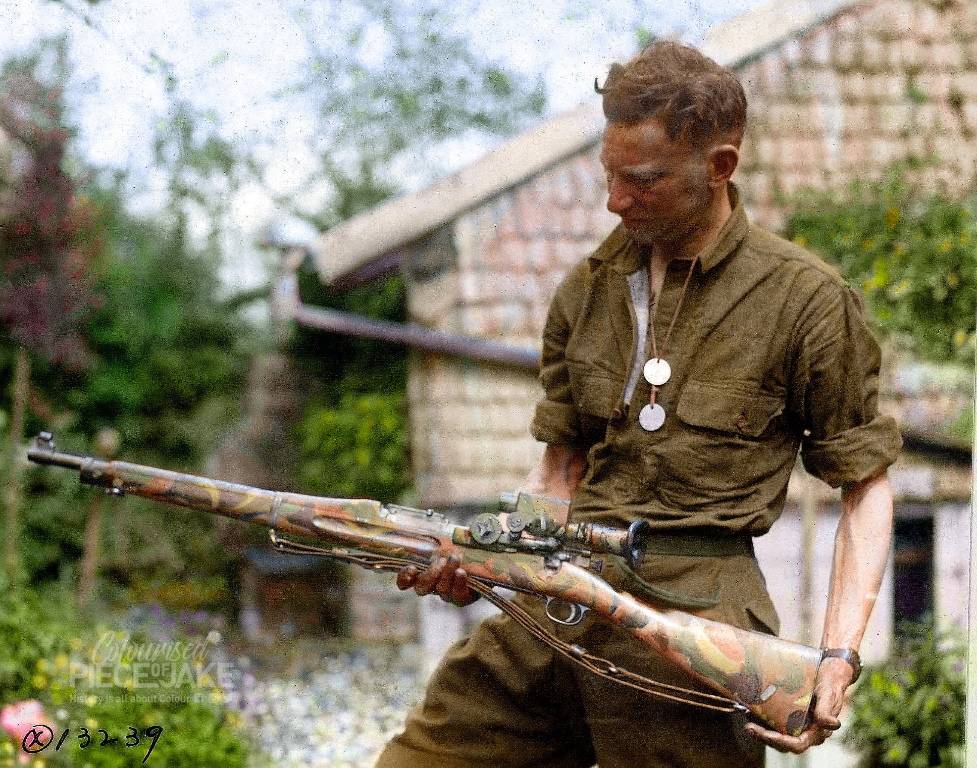 A camouflaged Springfield Rifle with telescopic sight used by snipers