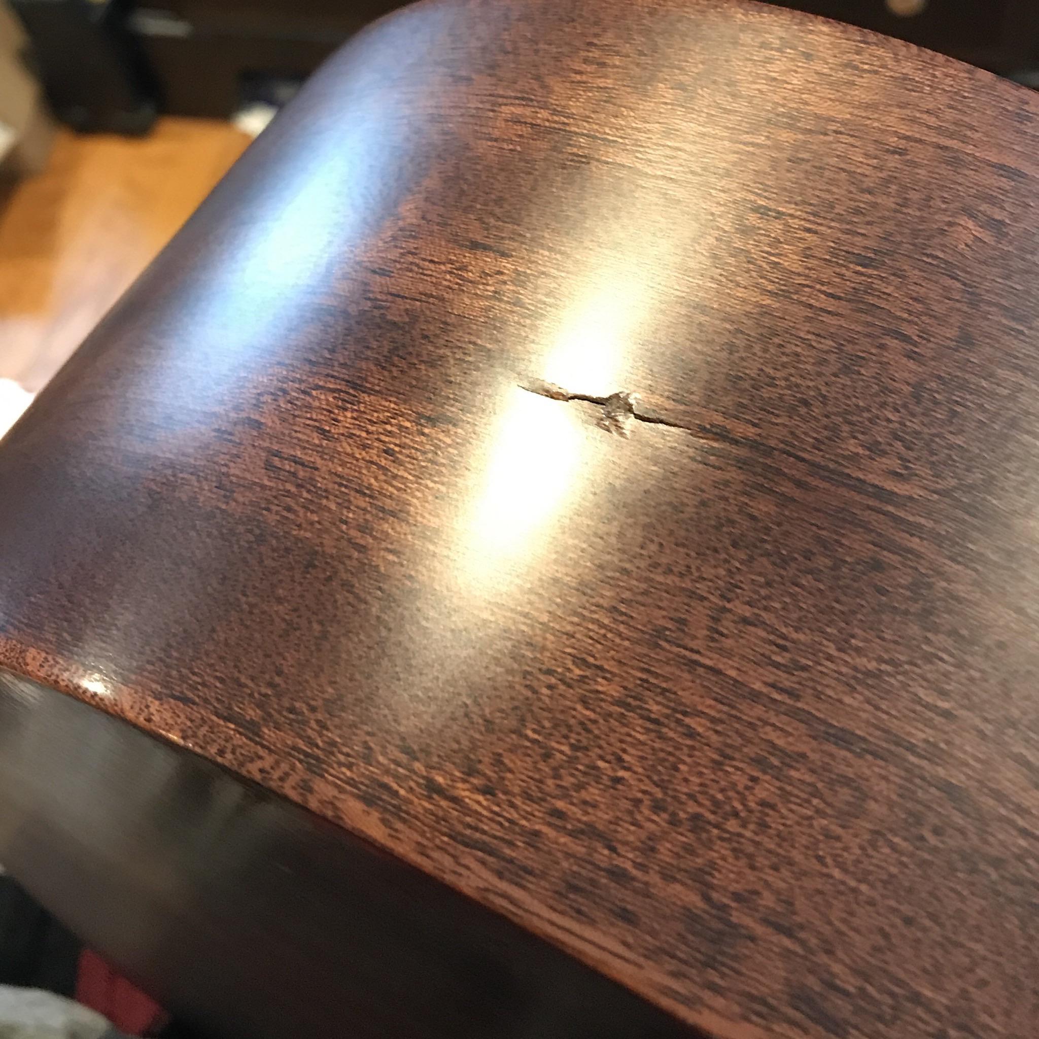 I accidentally made crack in the body of my acoustic guitar. Should I