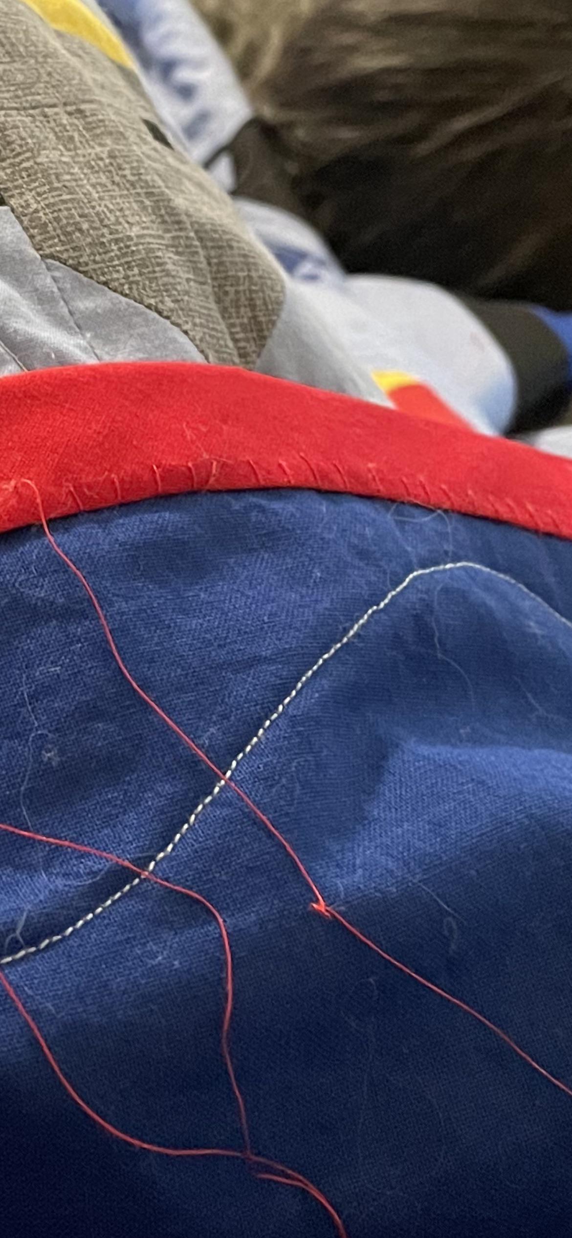 Currently binding my first quilt. I meant to do a more invisible stitch