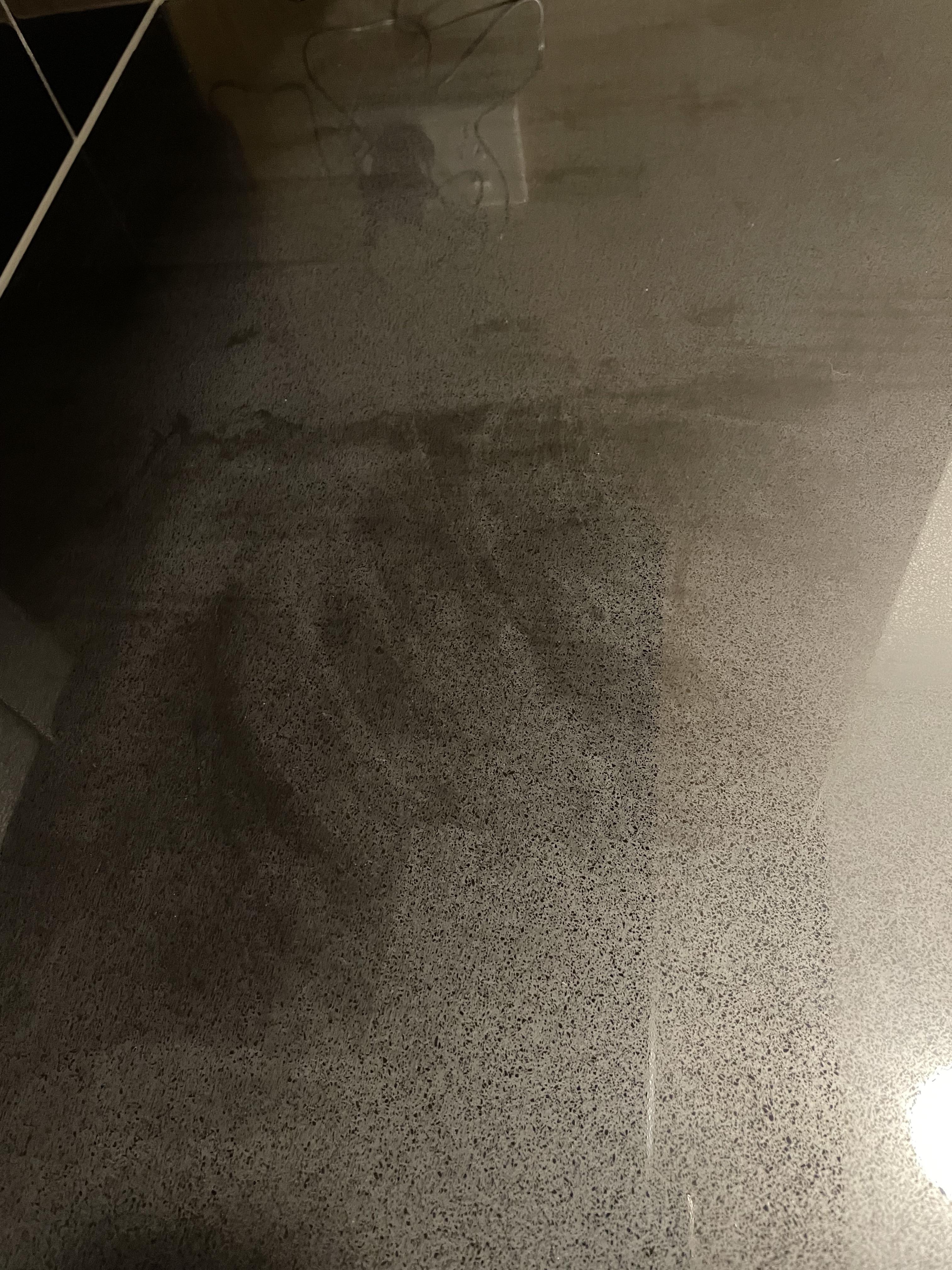 How do I clean black engineered stone benchtop without streaks? Tried
