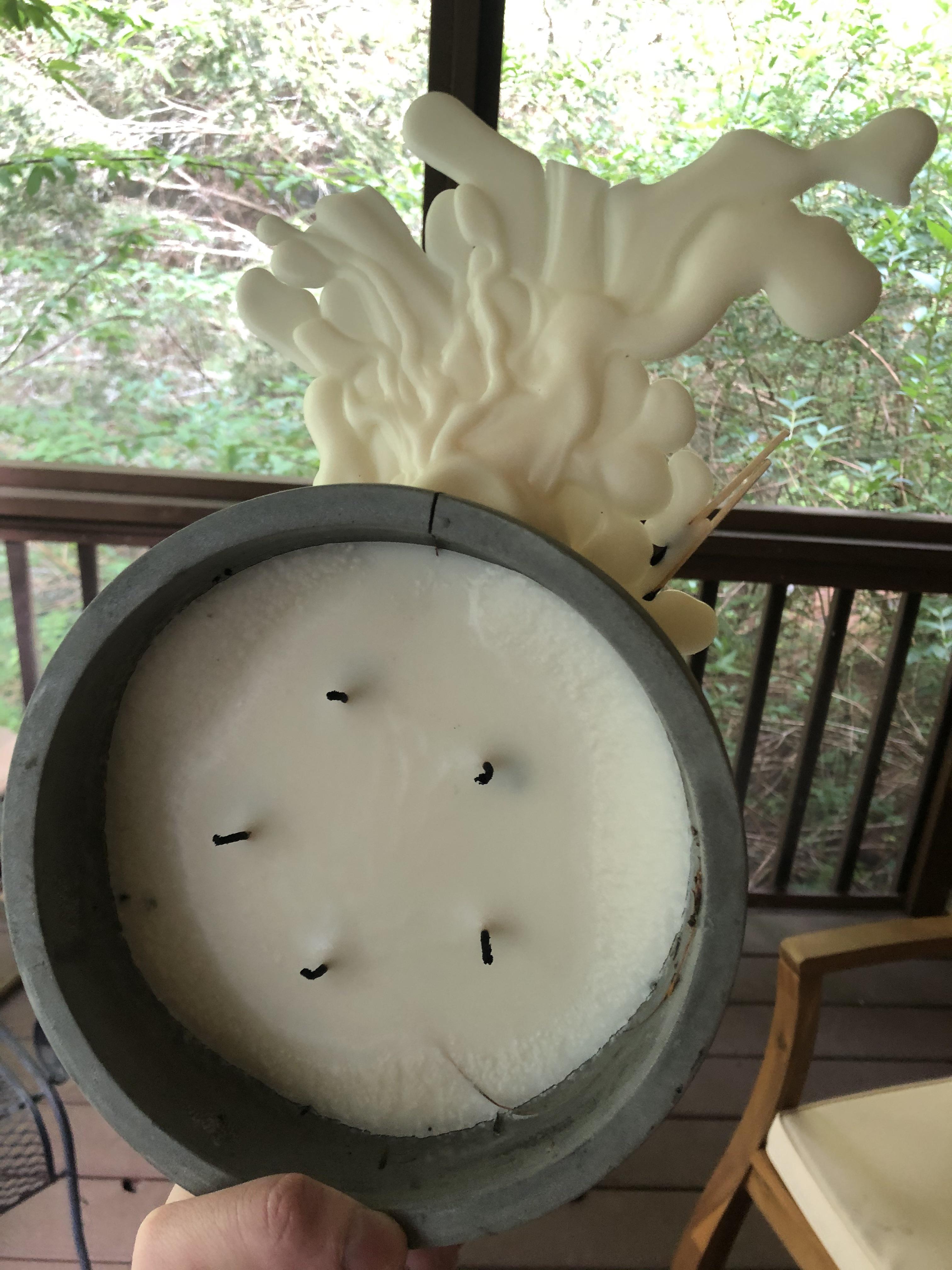 My candle cracked and leaked a ton of wax which dried like this r