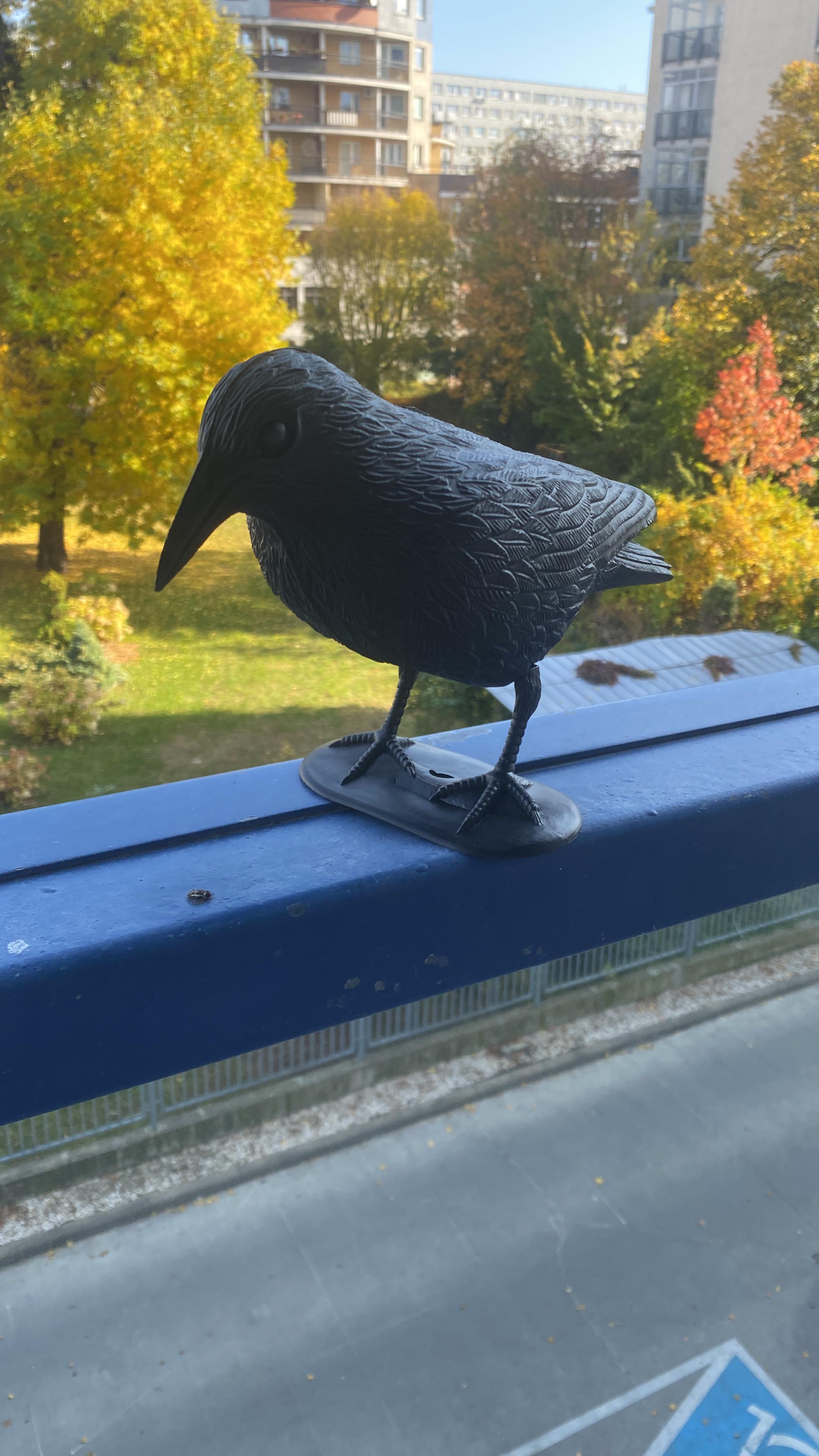 How to attach this fake bird to the railing on the balcony so it doesn
