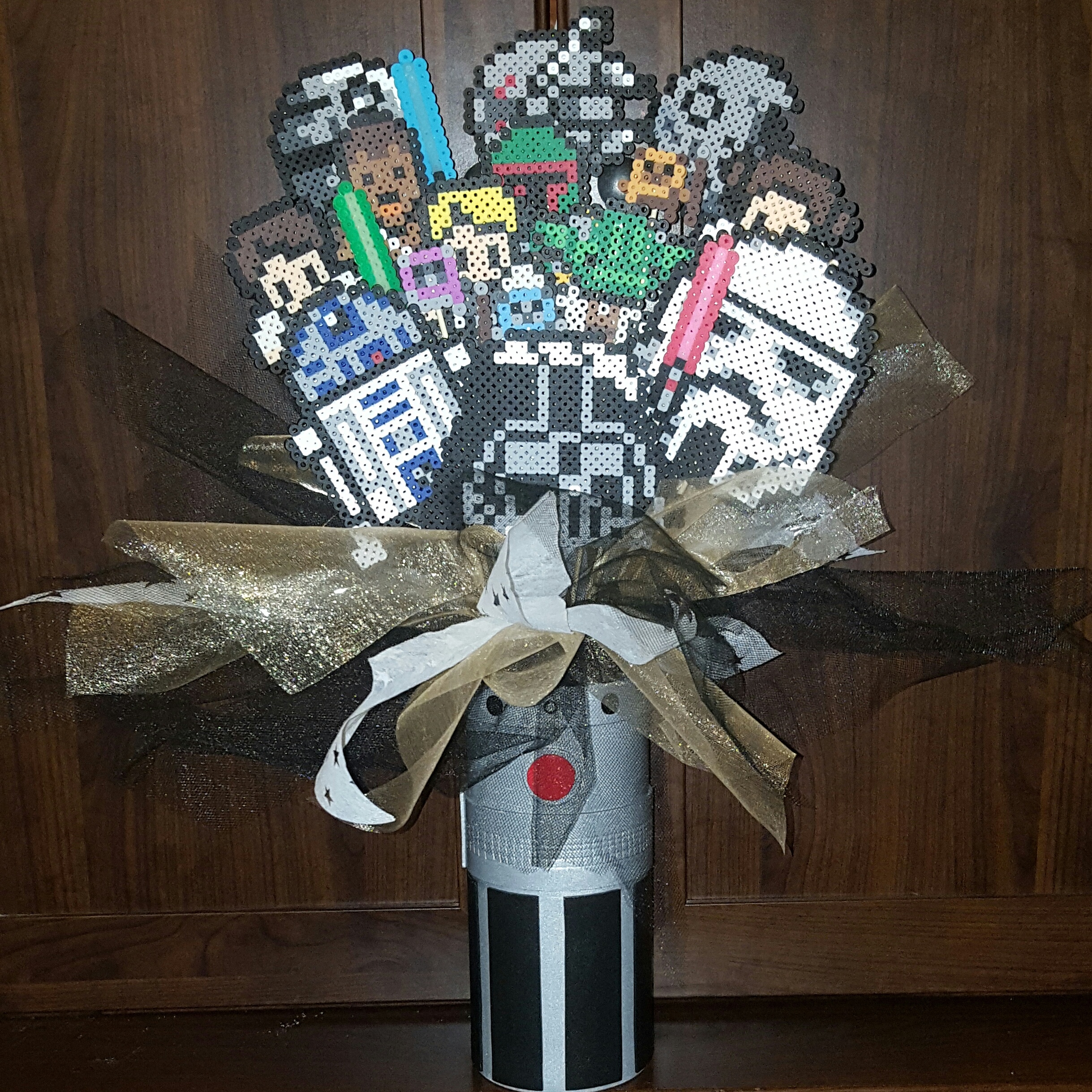 Star Wars themed bouquet in a vase that I covered with craft foam to look like a lightsaber