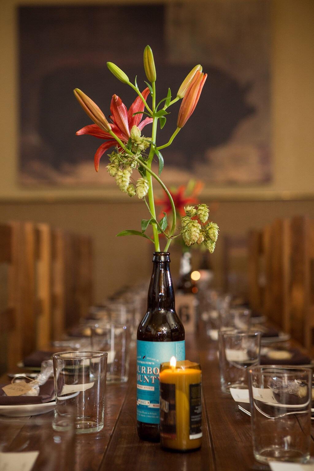 Wedding at a beer hall required beer bottle vases, beer bottle candles