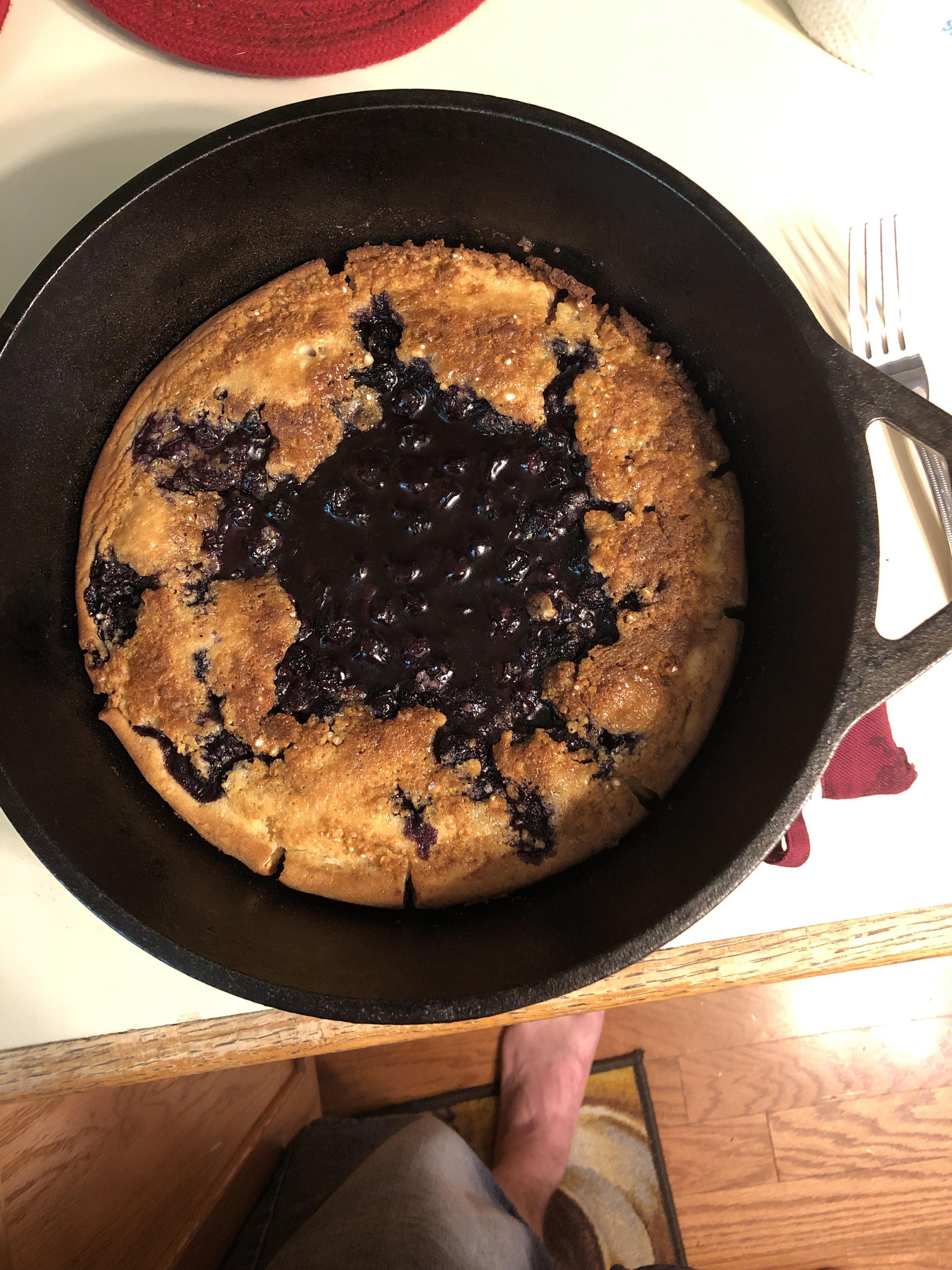 Cobbler made in a cast iron skillet. Blueberry with wine reduction for
