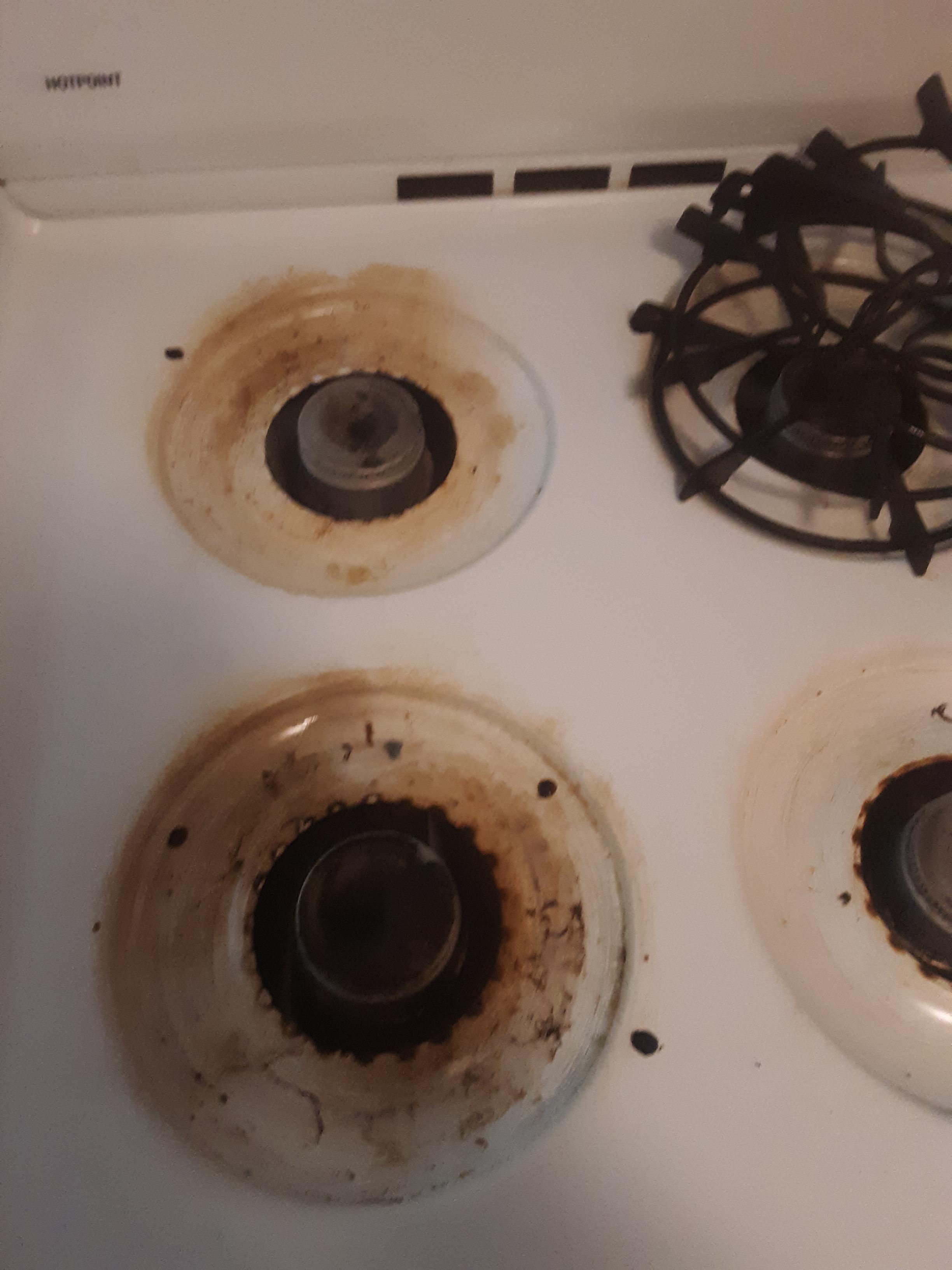 How to clean metal stove top with burnt on...stuff? (I know some of it