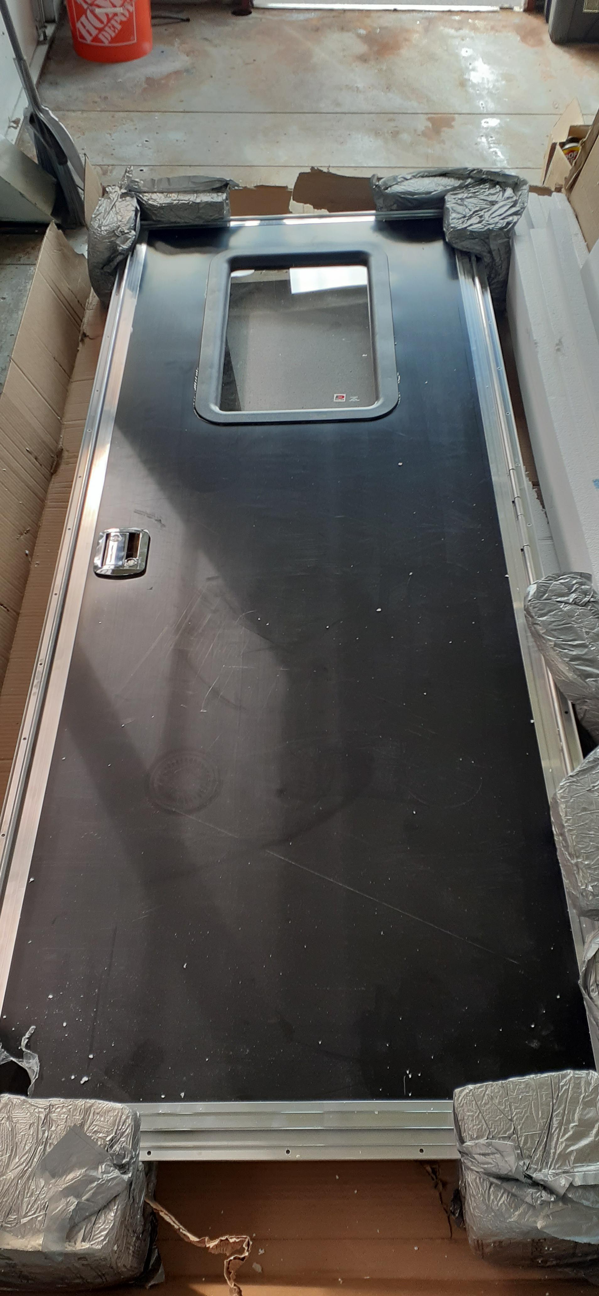 We'r recieved our new Dexter RV door today! Can't wait to install it! r/skoolie
