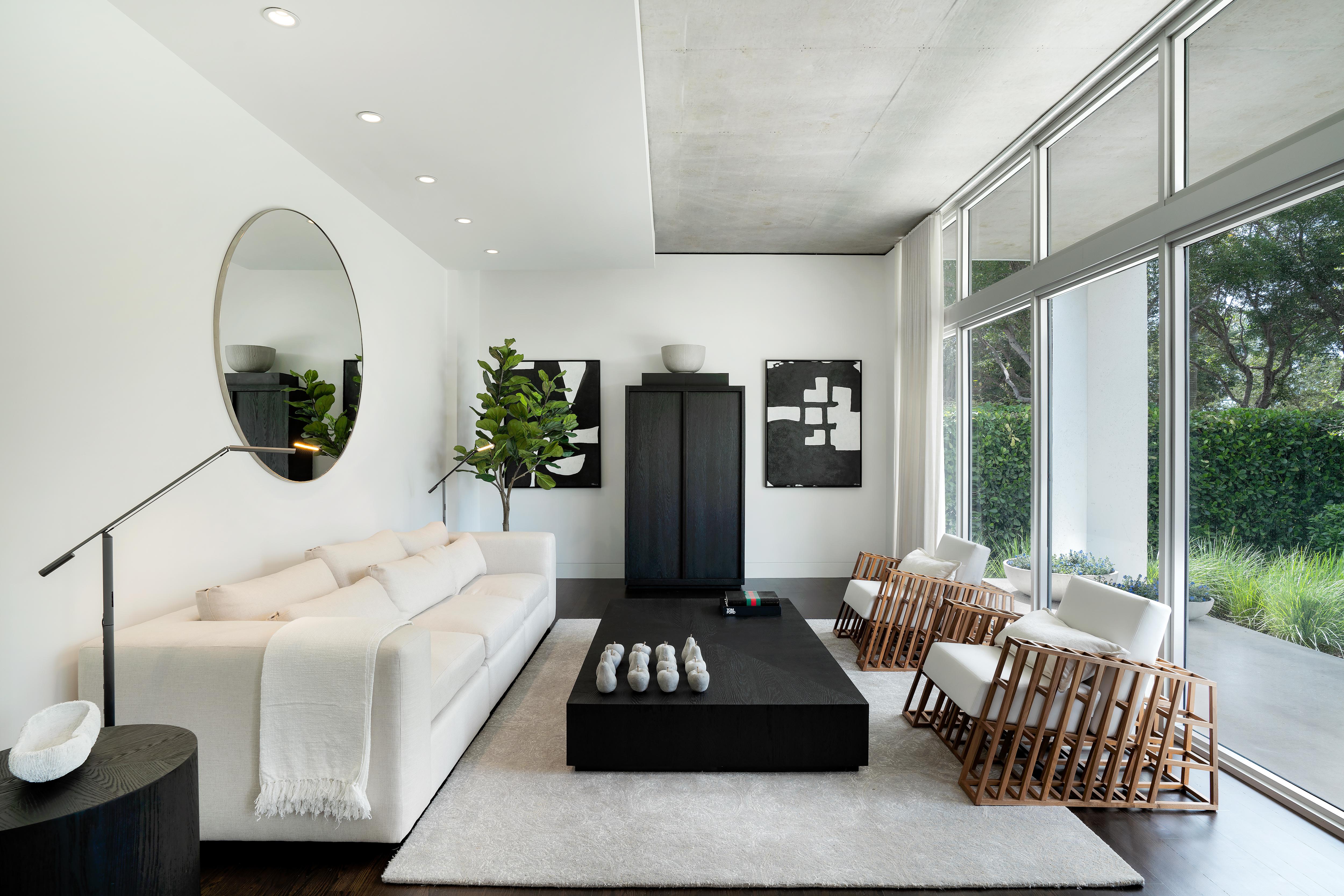 South Florida Living Room with Floor to Ceiling Windows and Exposed