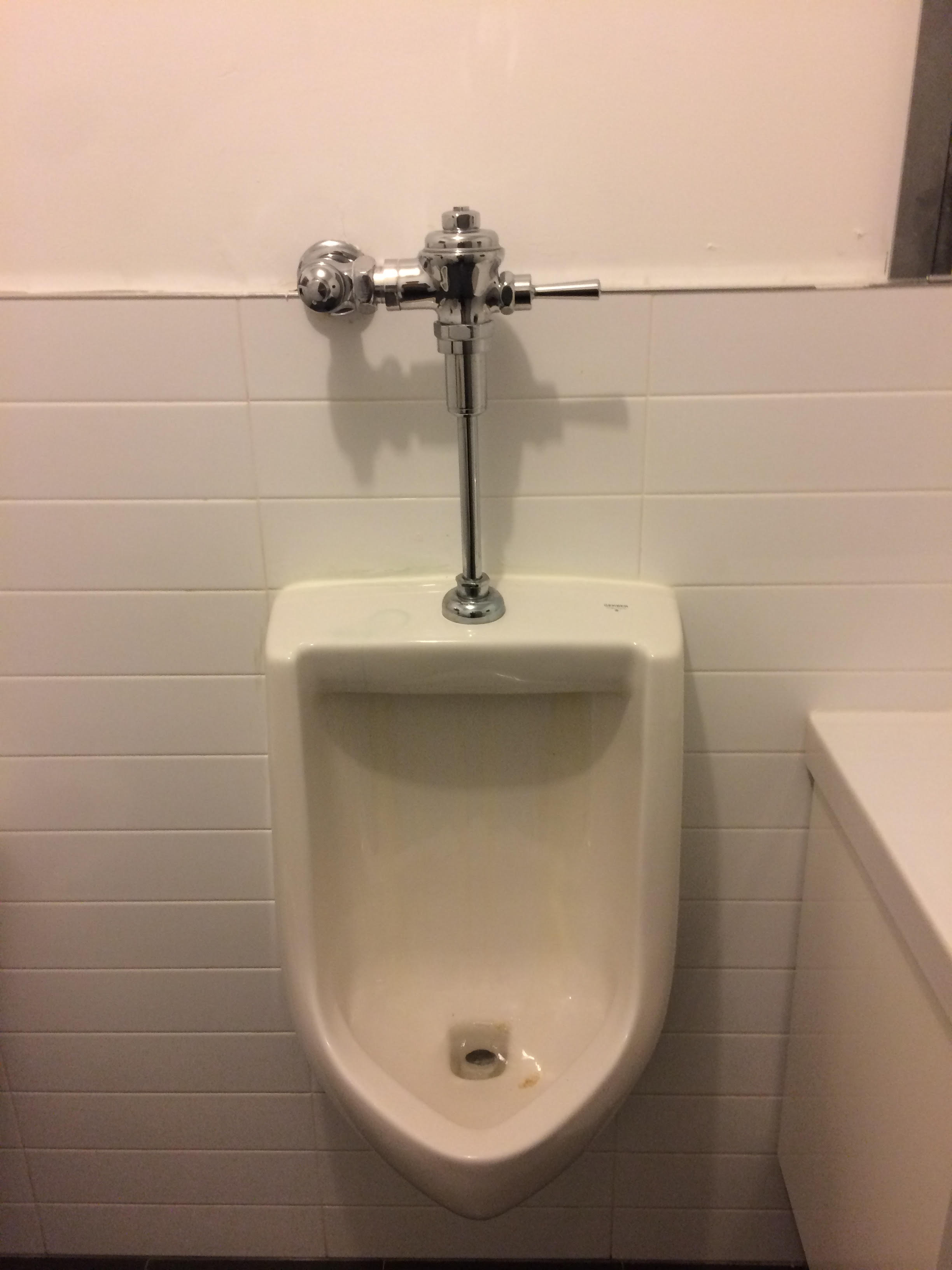 Urinal doesn't flush anymore, but puts out a steady slow trickle of