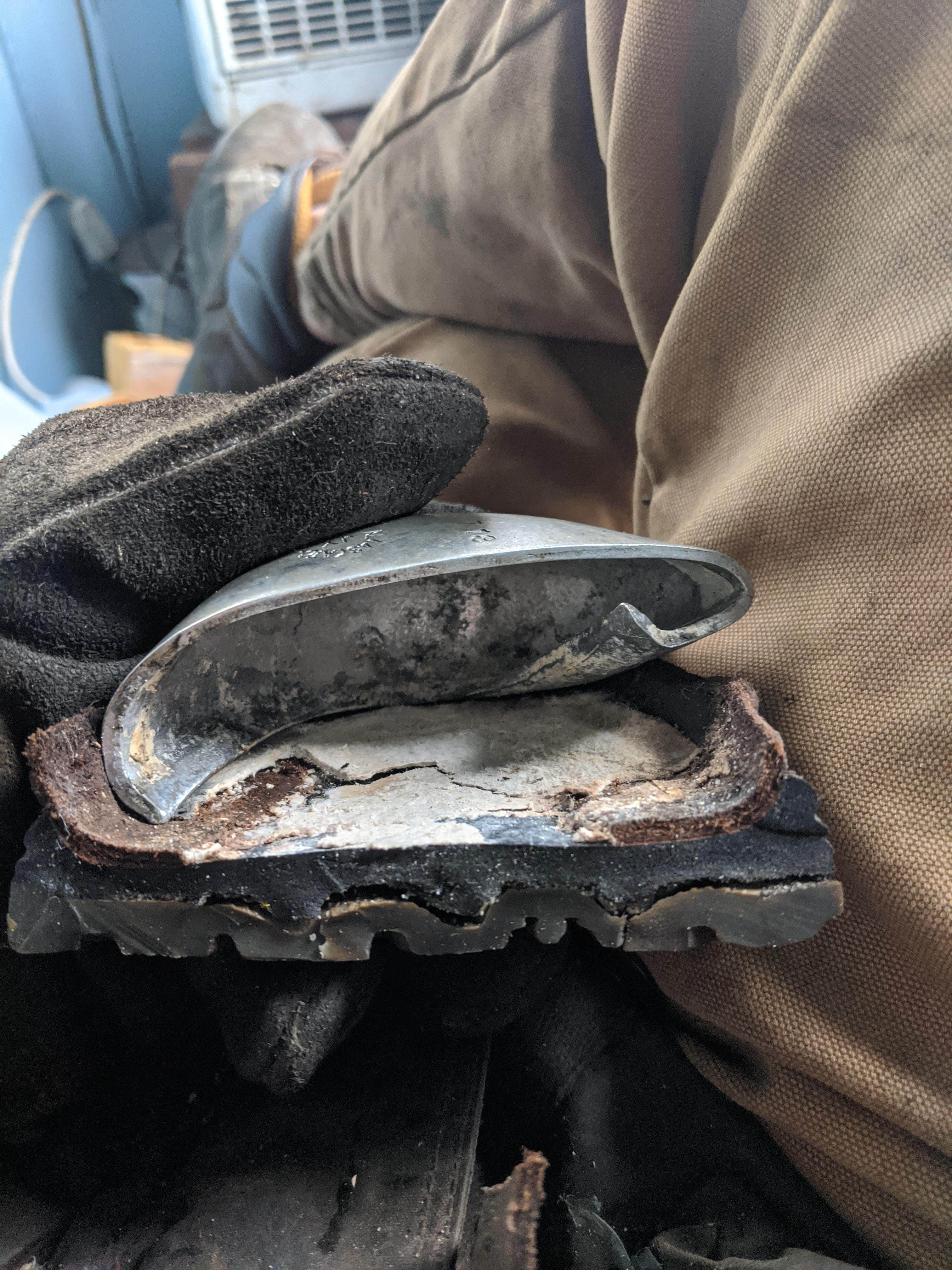 The steel toe of a boot after being run over by a fully loaded semi