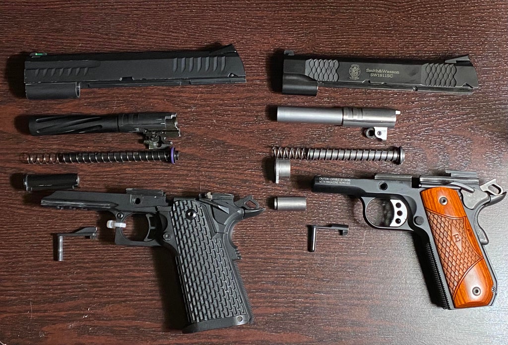 One of these guns is fake (airsoft) and the other is real, can you tell