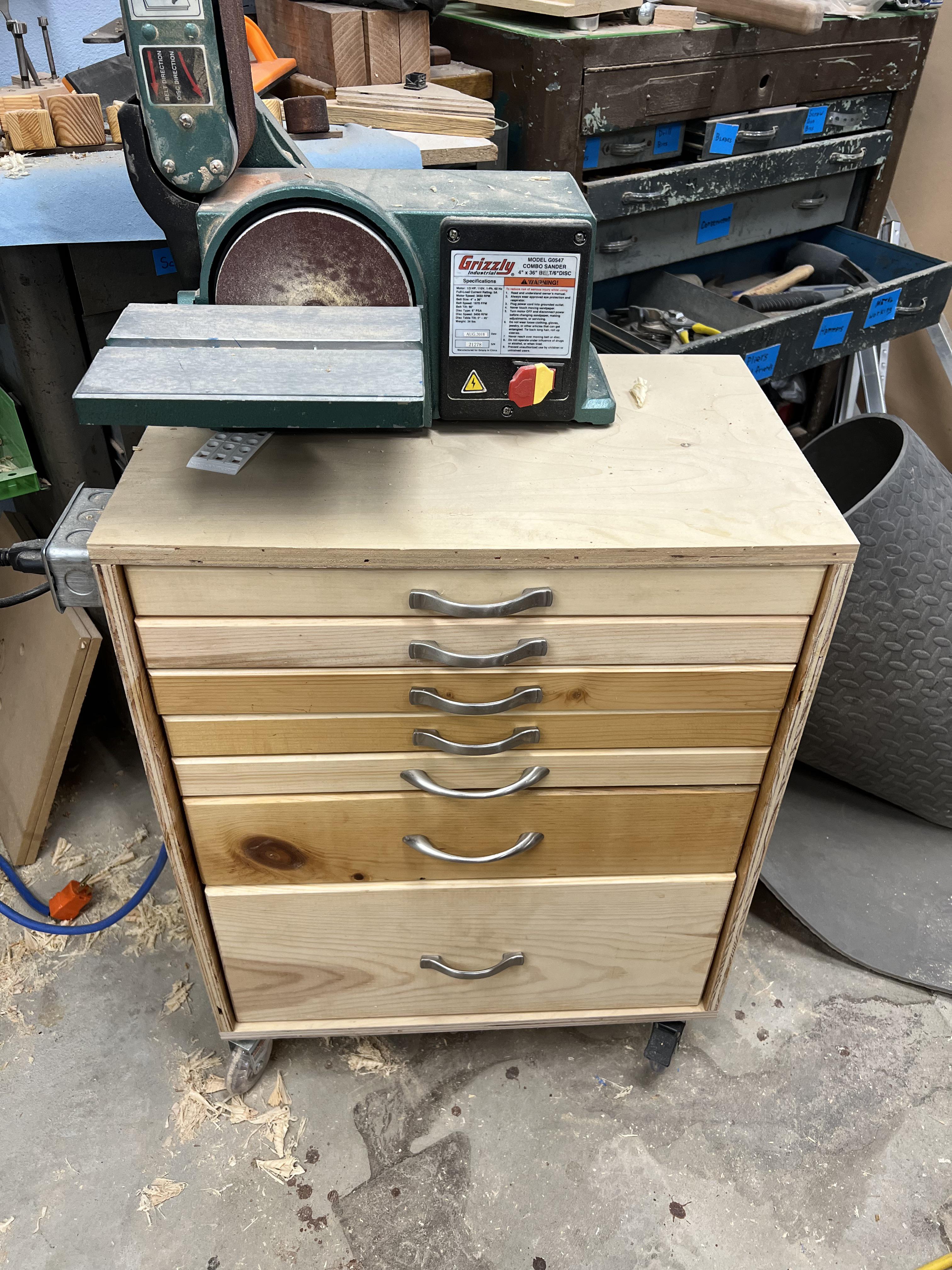 My latest shop furniture a to hold my sander, sandpaper