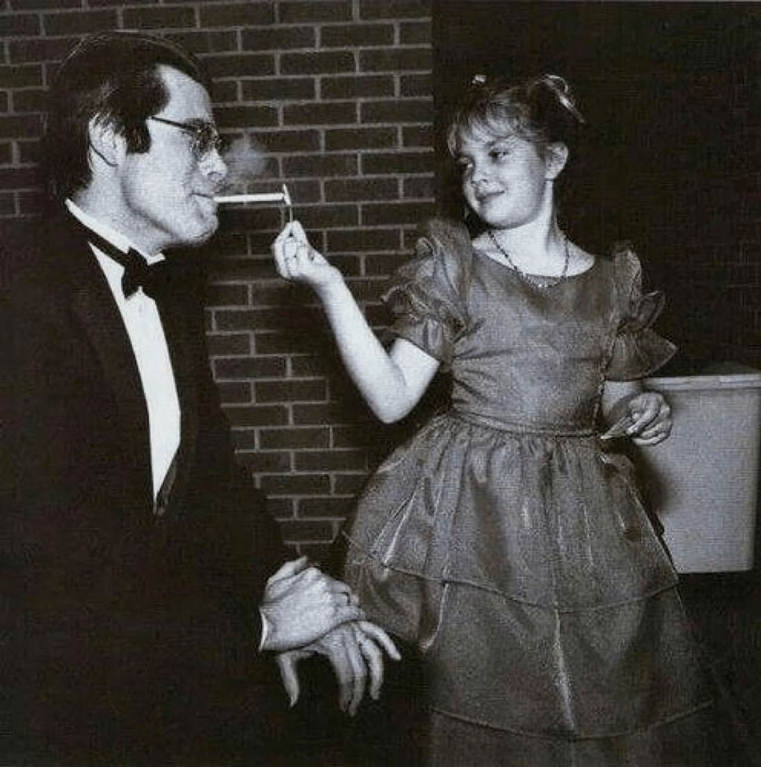 9yearold Drew Barrymore lights Stephen King's cigarette at the