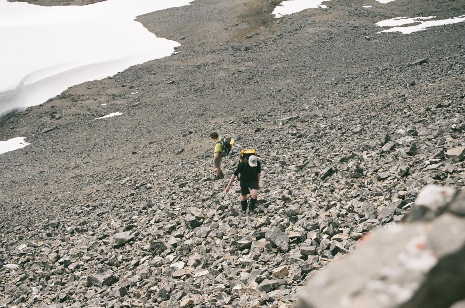 Picking a way up through the snow and scree to peak 1 of Mt. Lougheed