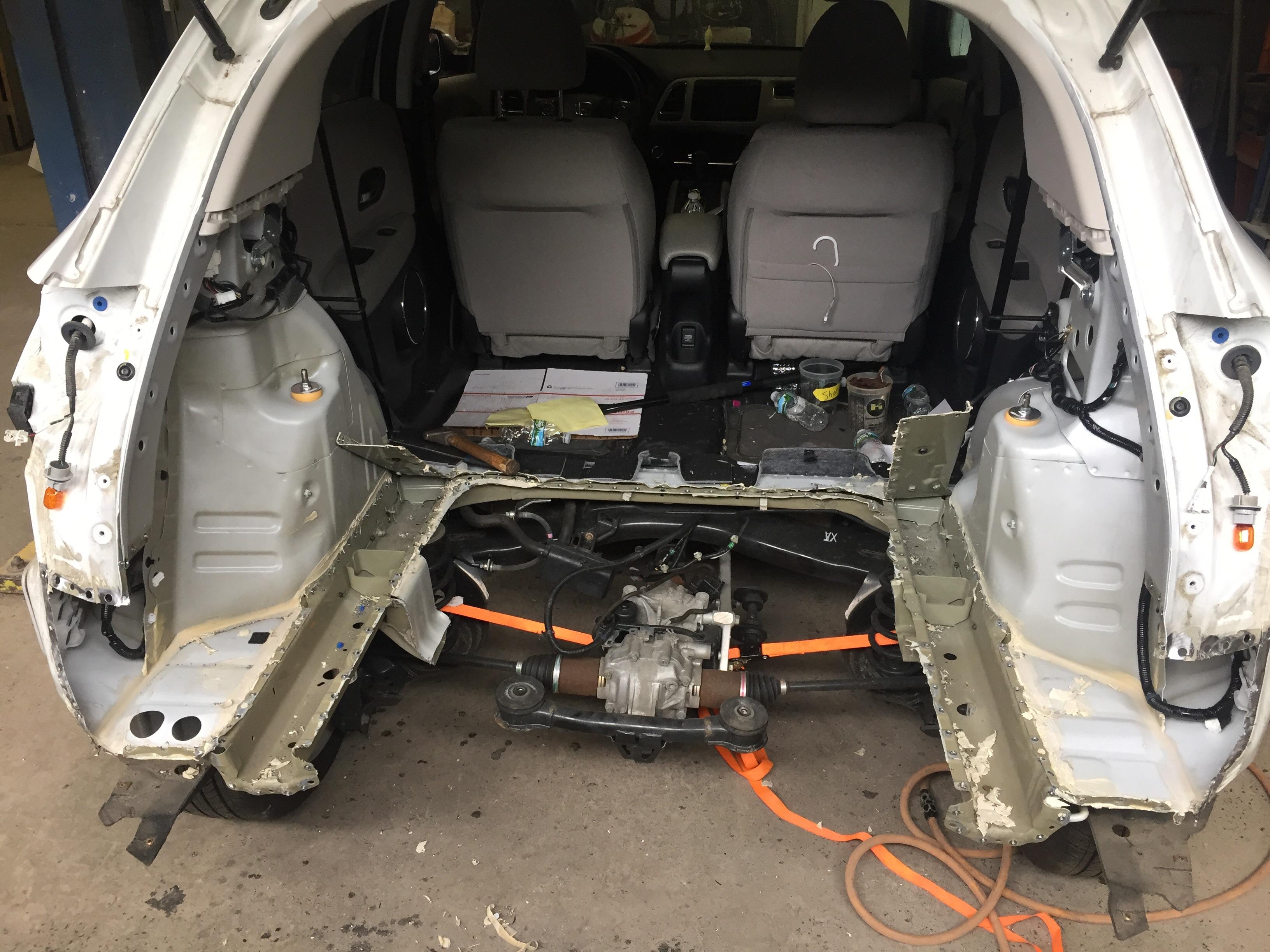 Customer states loud wind noise coming from rear end of car