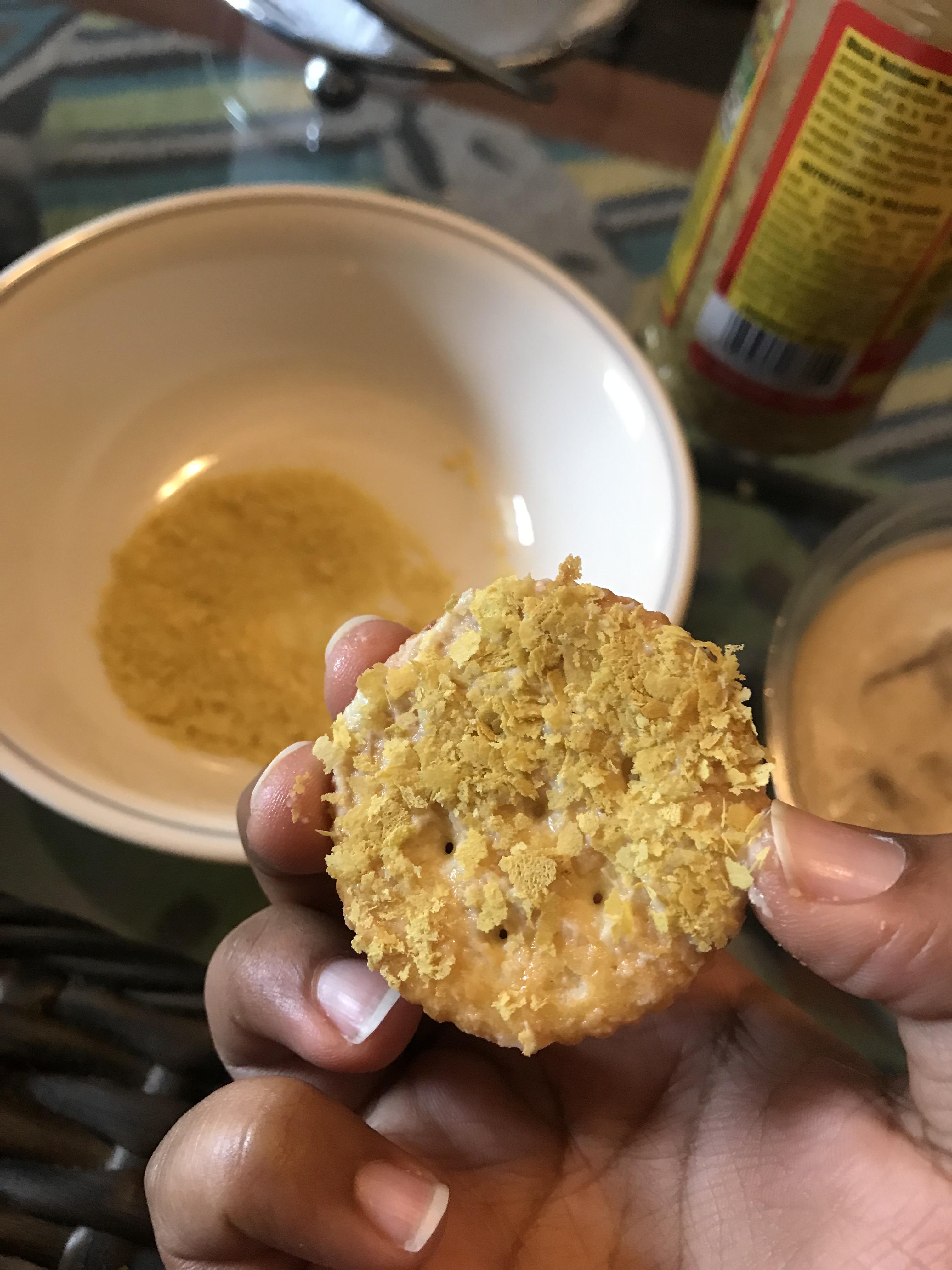 Ritz Cracker dipped in hummus and then dunked in a bowl of nooch r