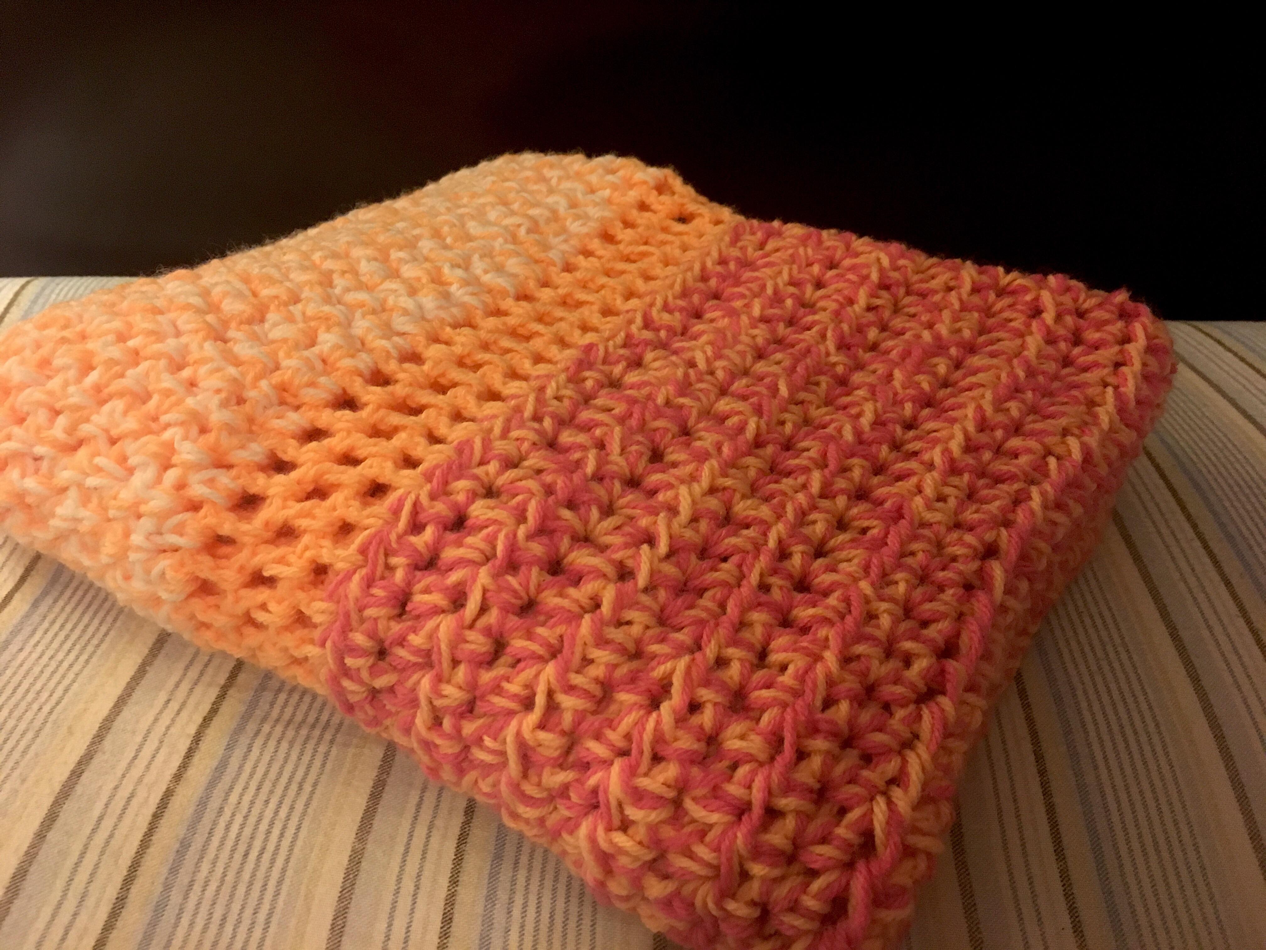 Blanket from scrap yarn— 3 colors. Used 2 yarns simultaneously so it’s a thick stitch r/crochet