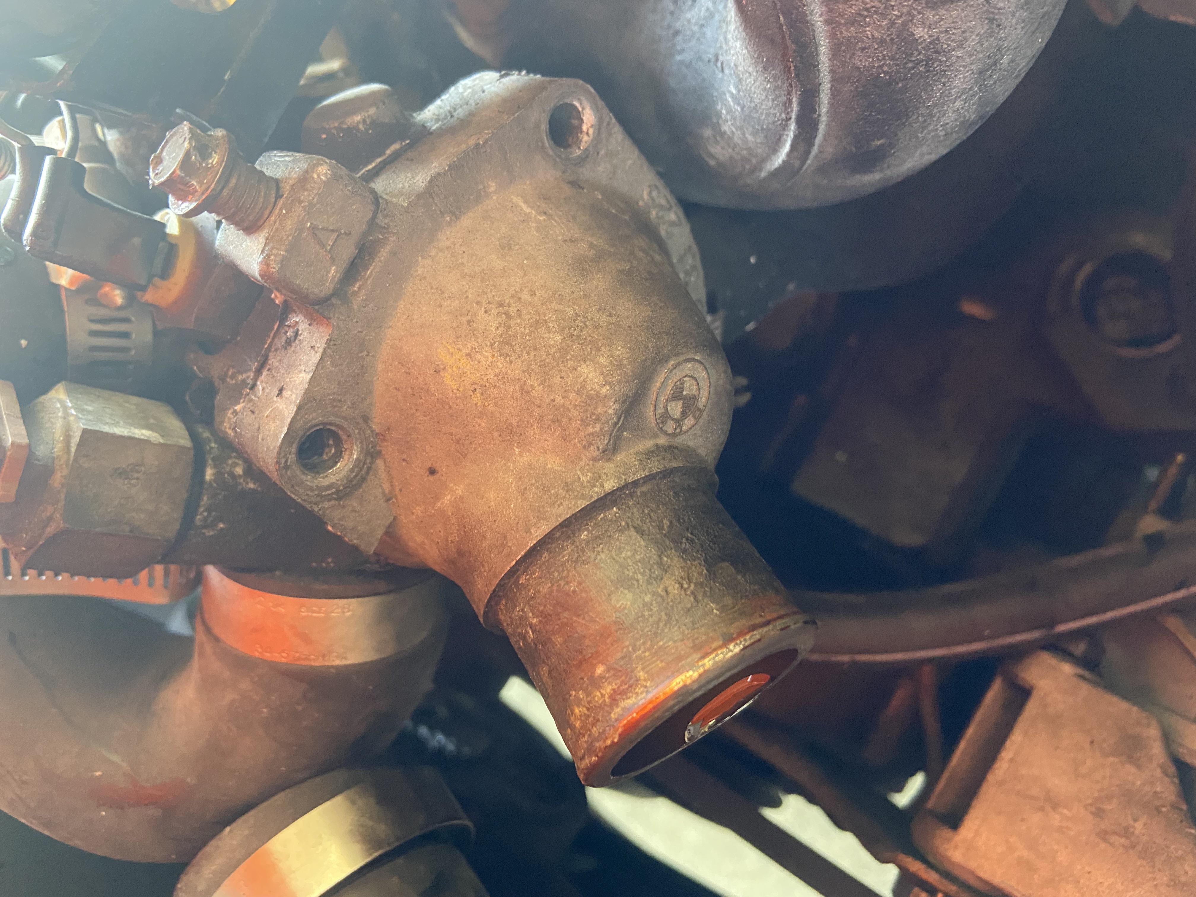 Anyone know how to take off this thermostat housing ? It’s not coming