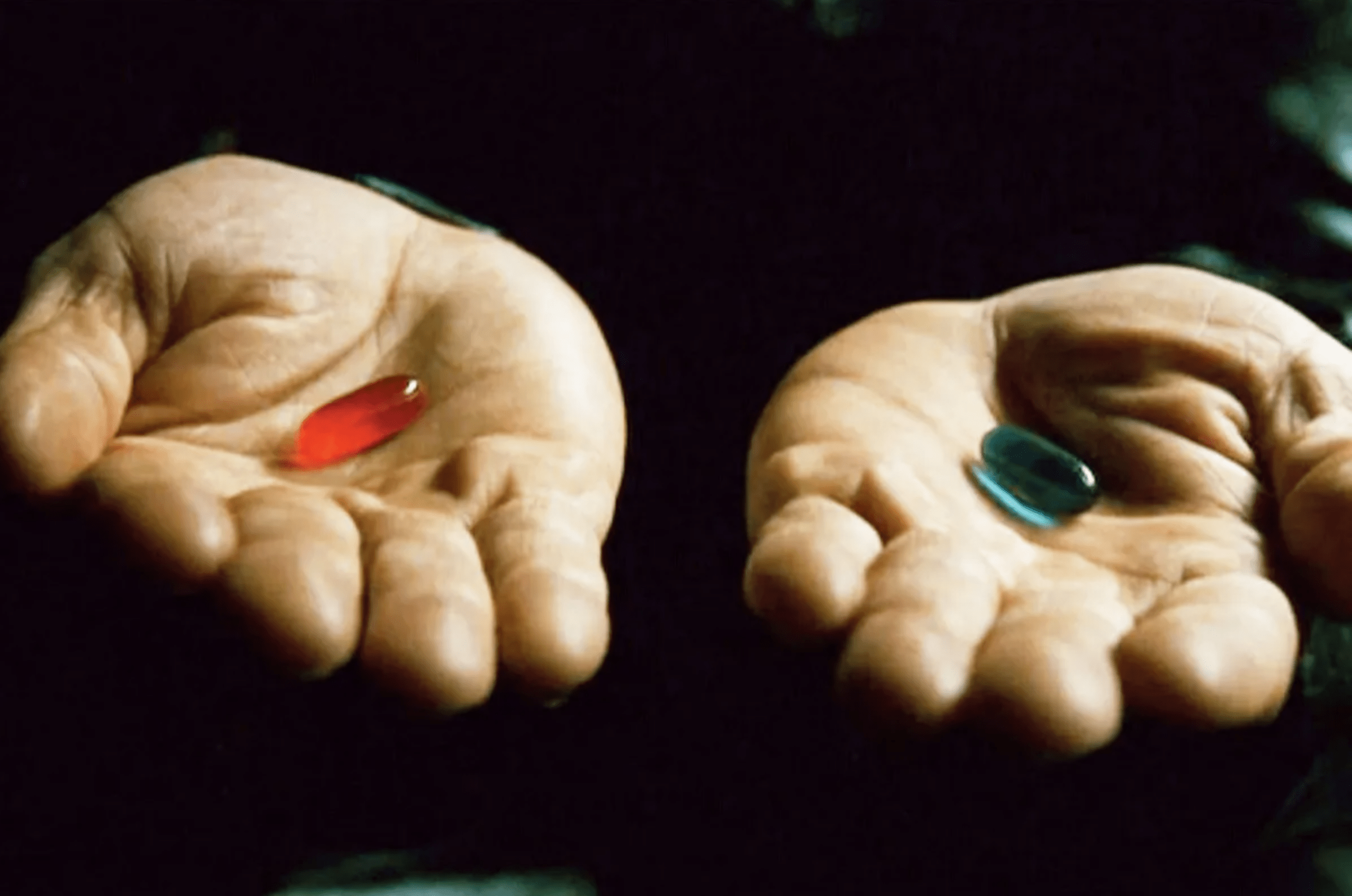 The two green pills Morpheus holds up in The Matrix (1999) look