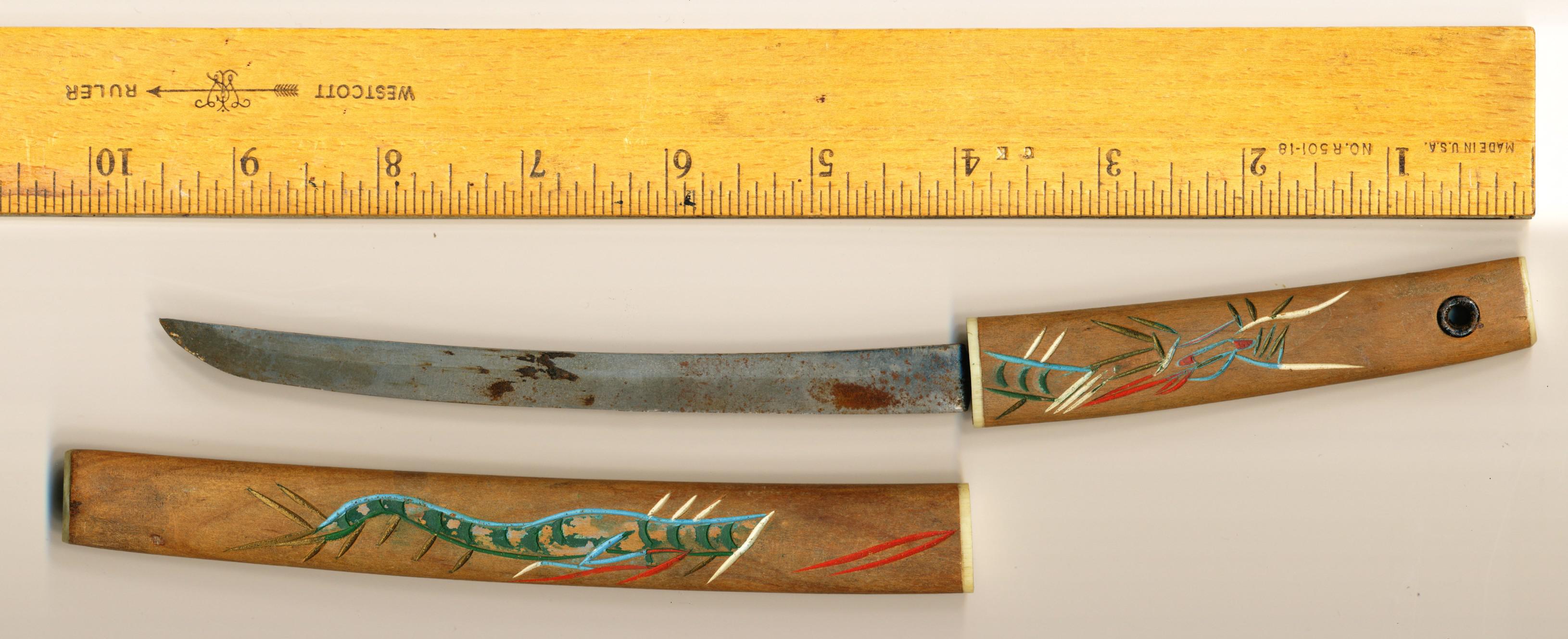 Thoughts on the origin of this knife with ornamental wood handle? Might